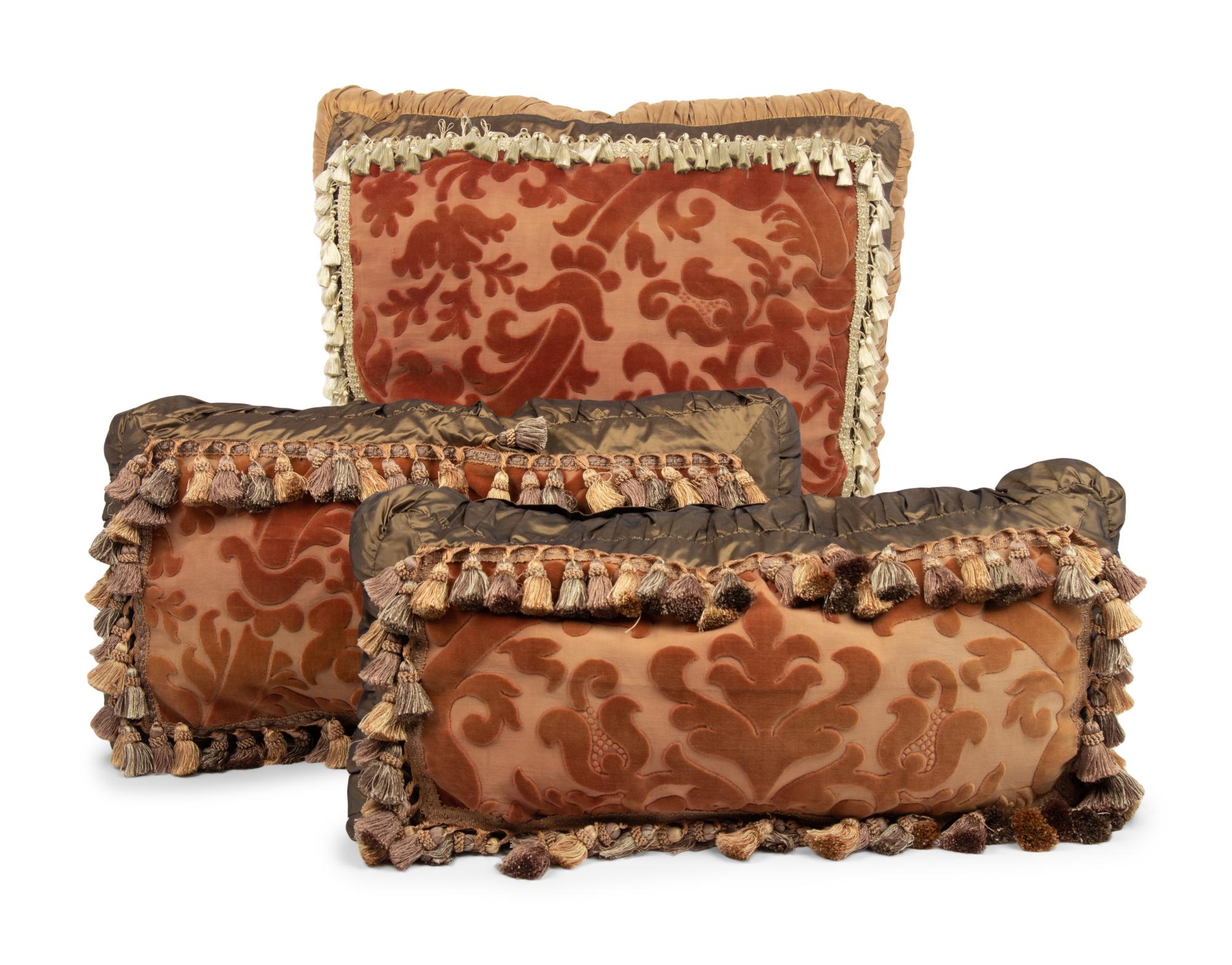 A Set of Three Velvet Upholstered Pillows with Tassels