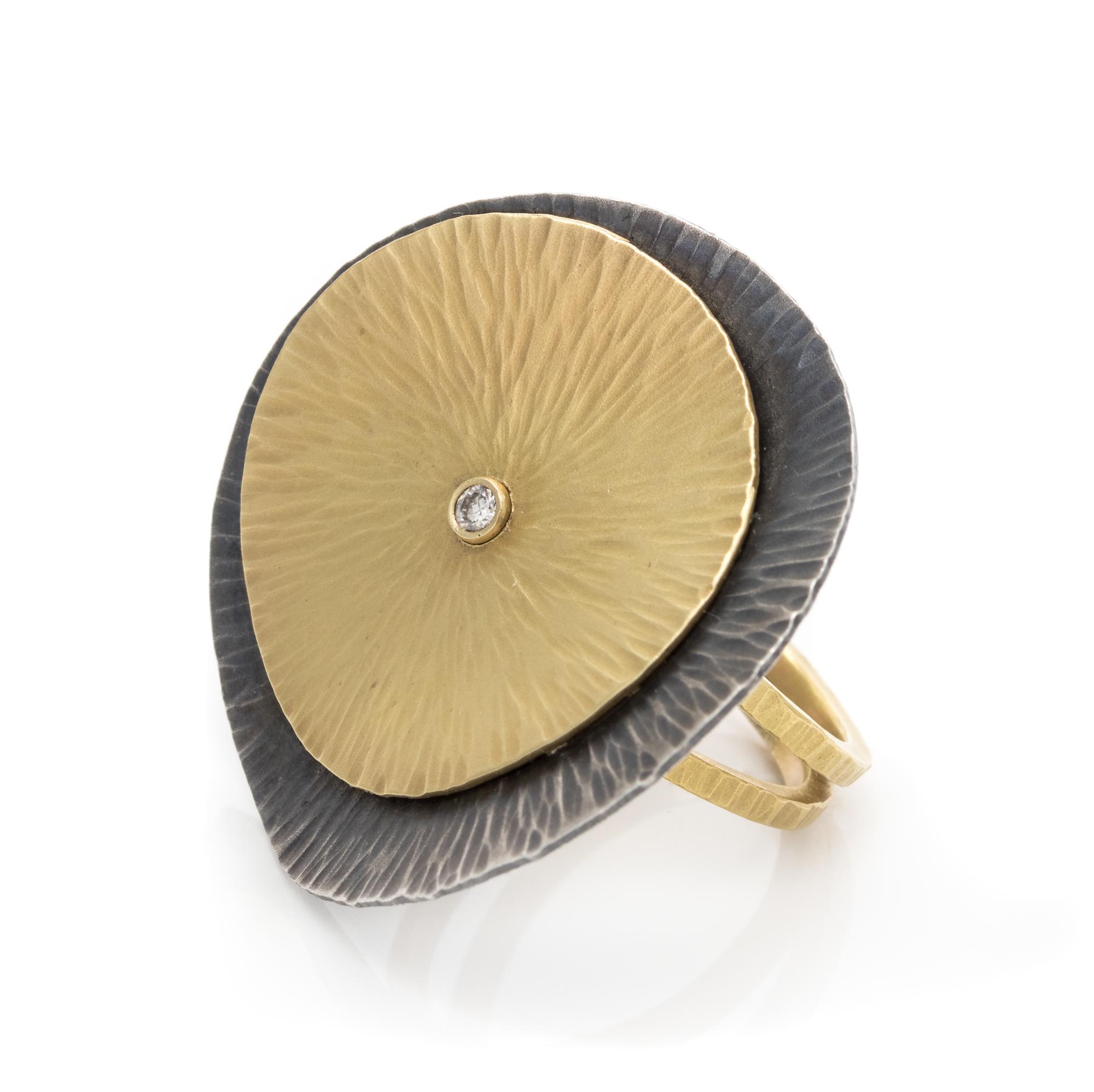 An Oxidized Silver, 18 Karat Yellow Gold and Diamond Ring, 8.95 dwts.