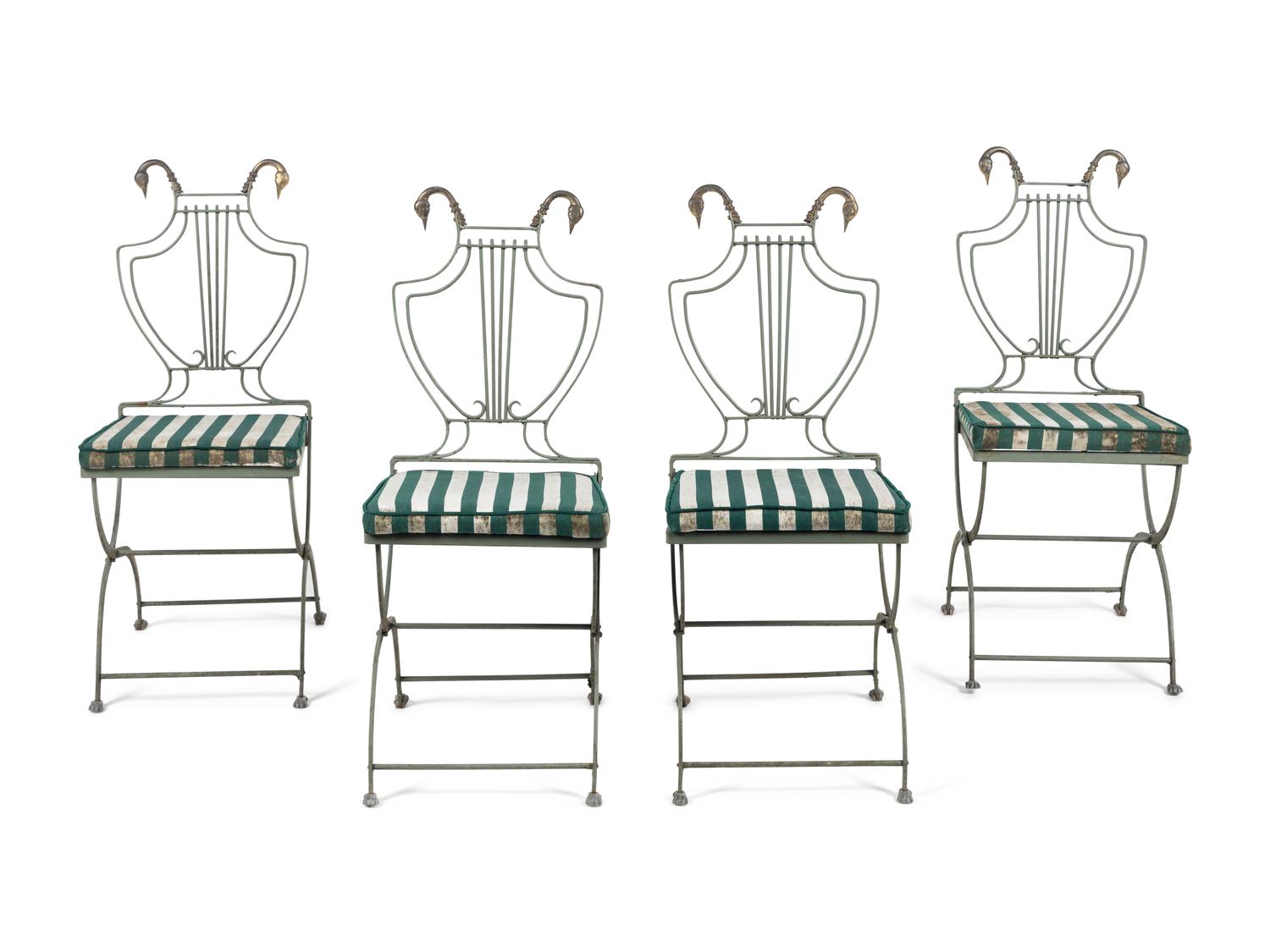 A Set of Four Painted Metal Folding Garden Chairs