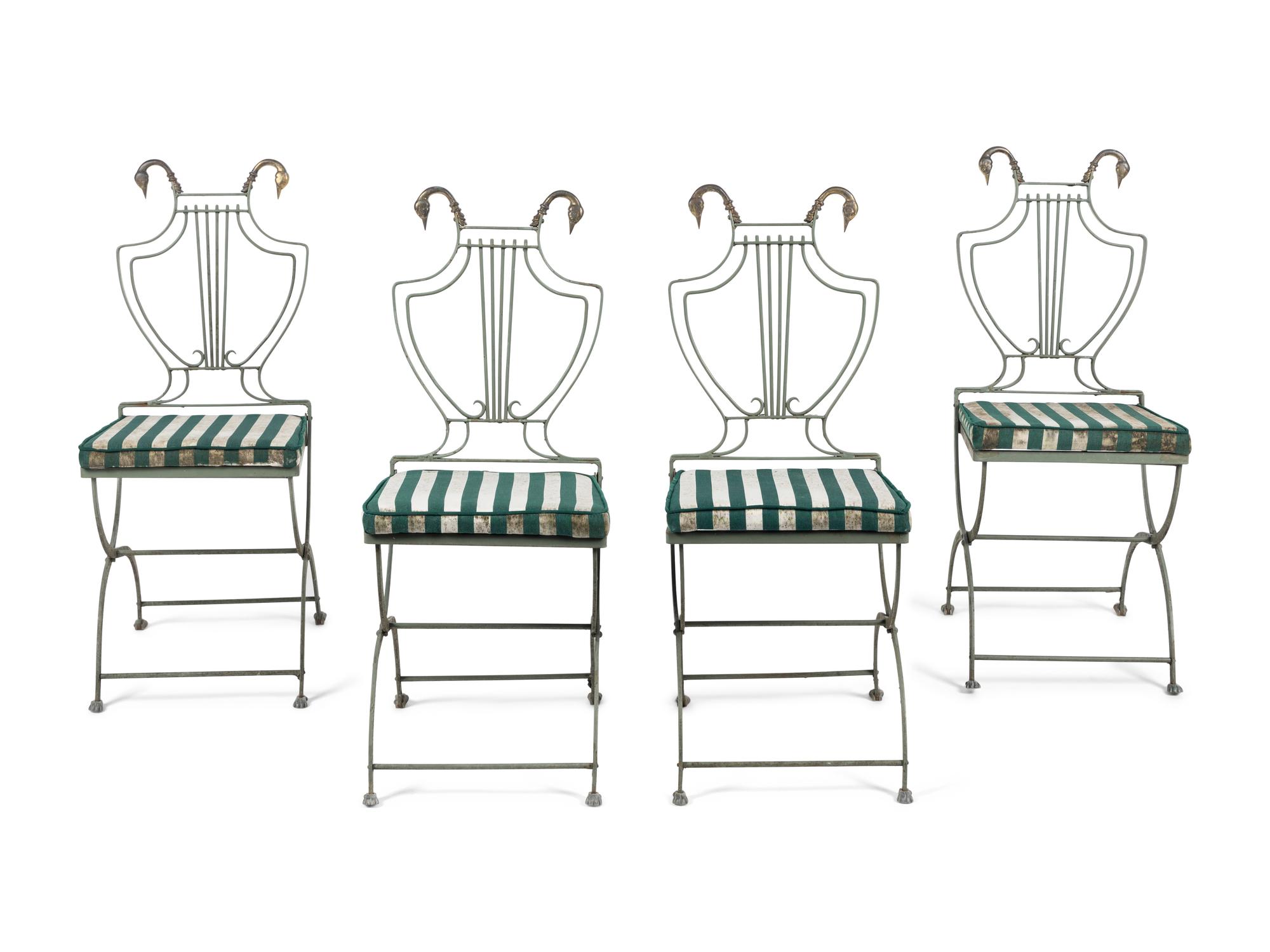 A Set of Four Painted Metal Folding Garden Chairs