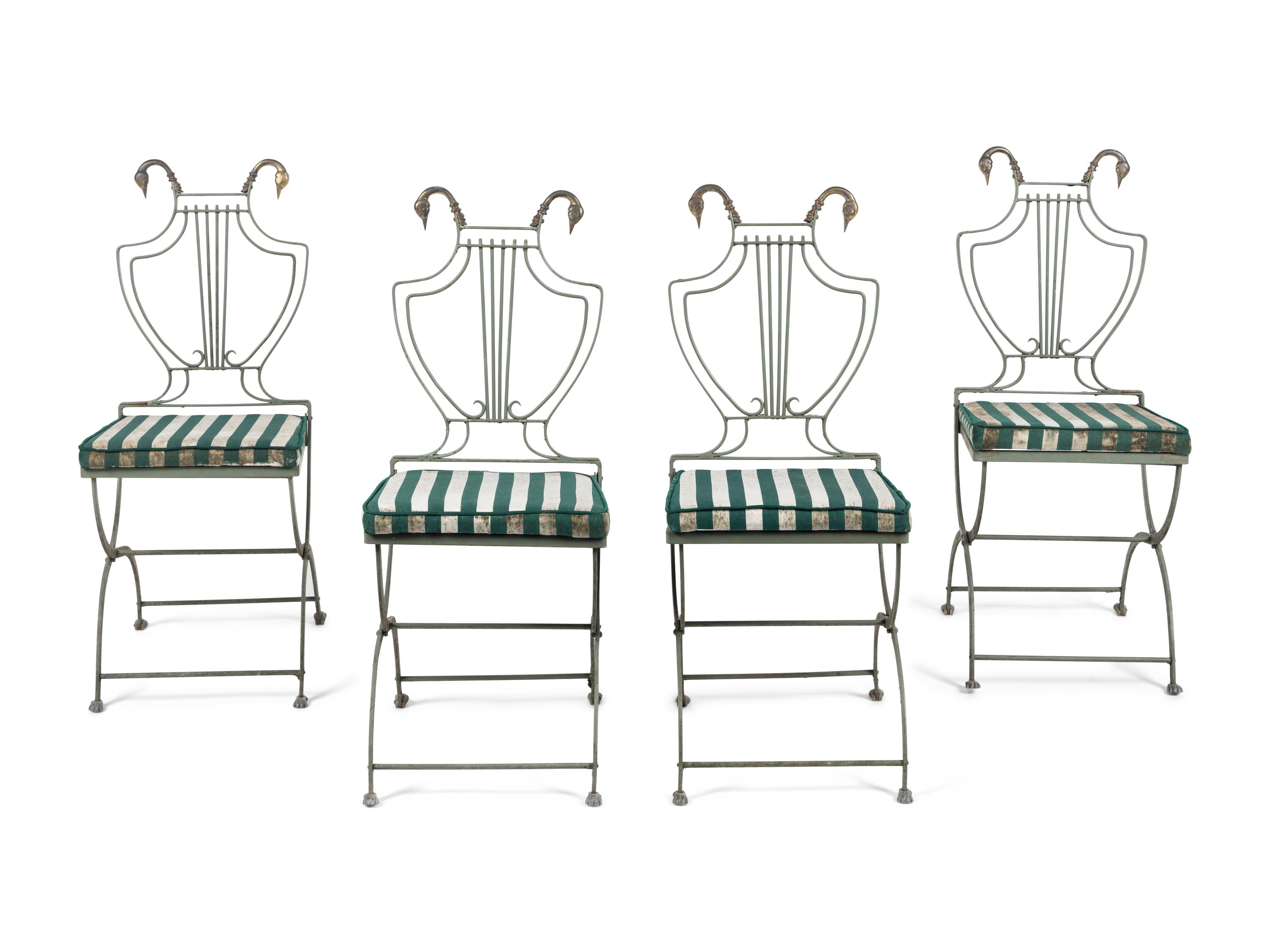 A Set of Four Painted Metal Folding Garden Chairs