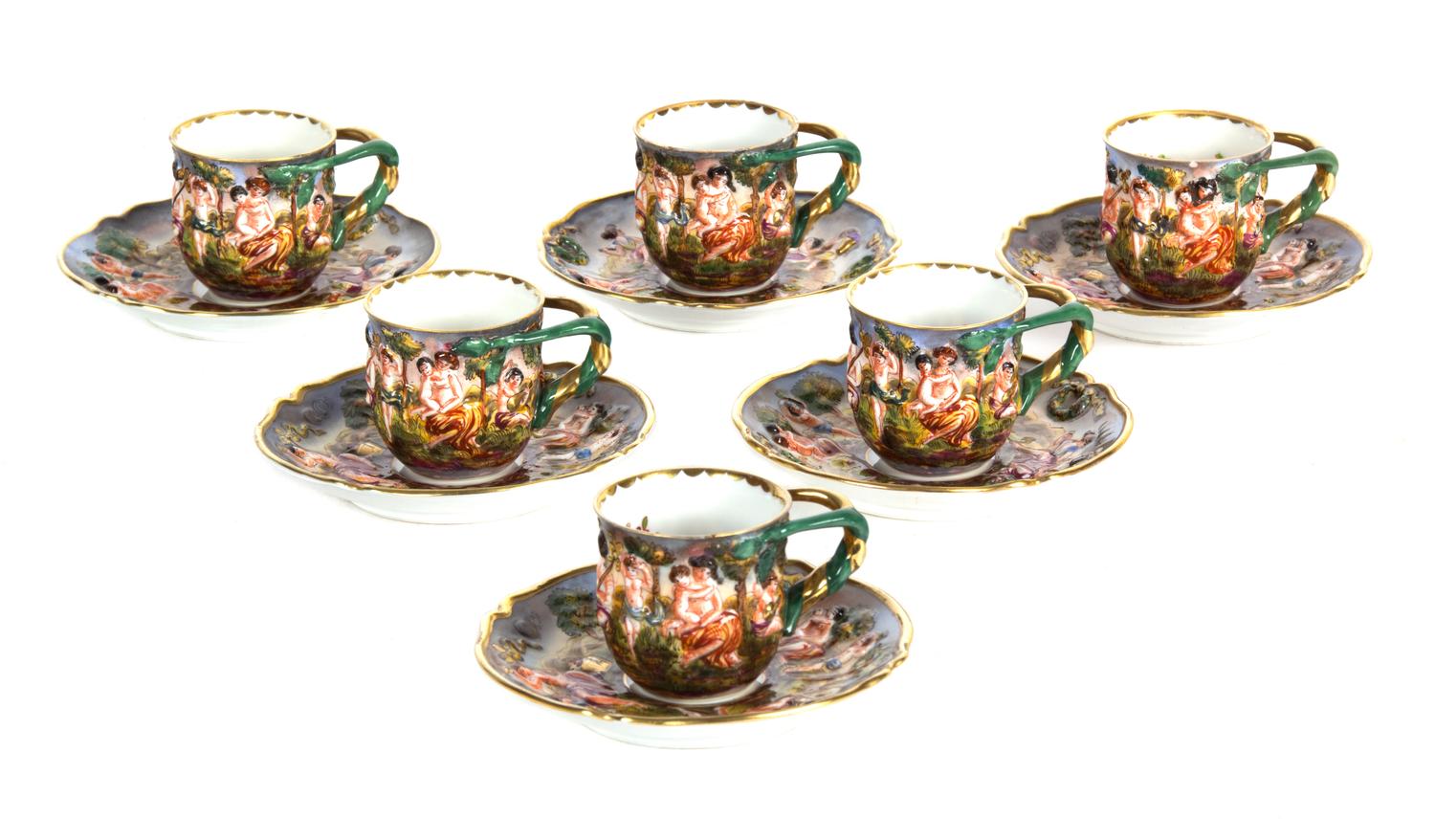 A Collection of Nine Capo-di-Monte Porcelain Demitasse Cups and Saucers Diameter of saucer 4 1/2 inches. — 19TH CENTURY