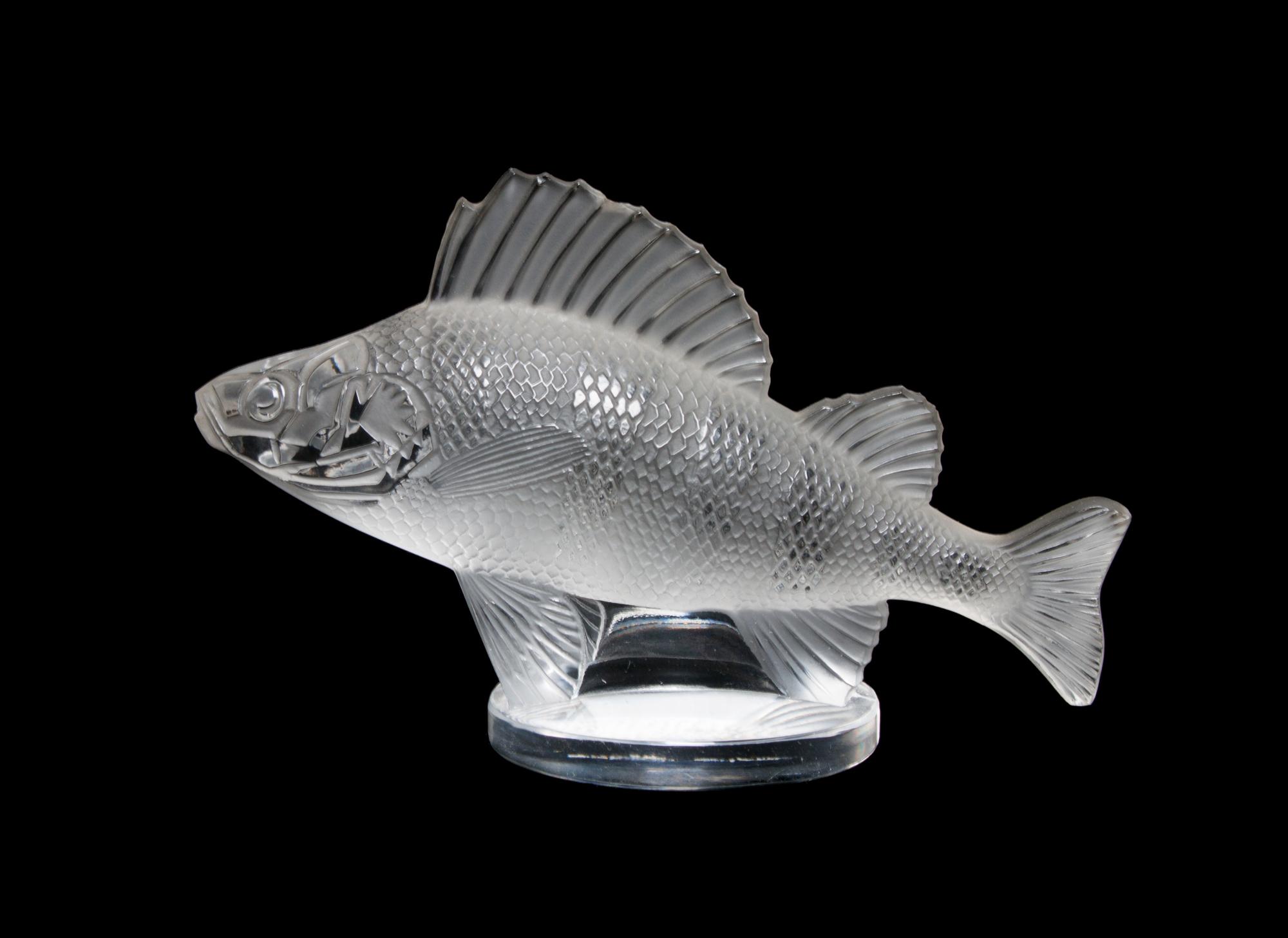 A Lalique Molded and Frosted Glass Paperweight Width 6 1/4 inches.