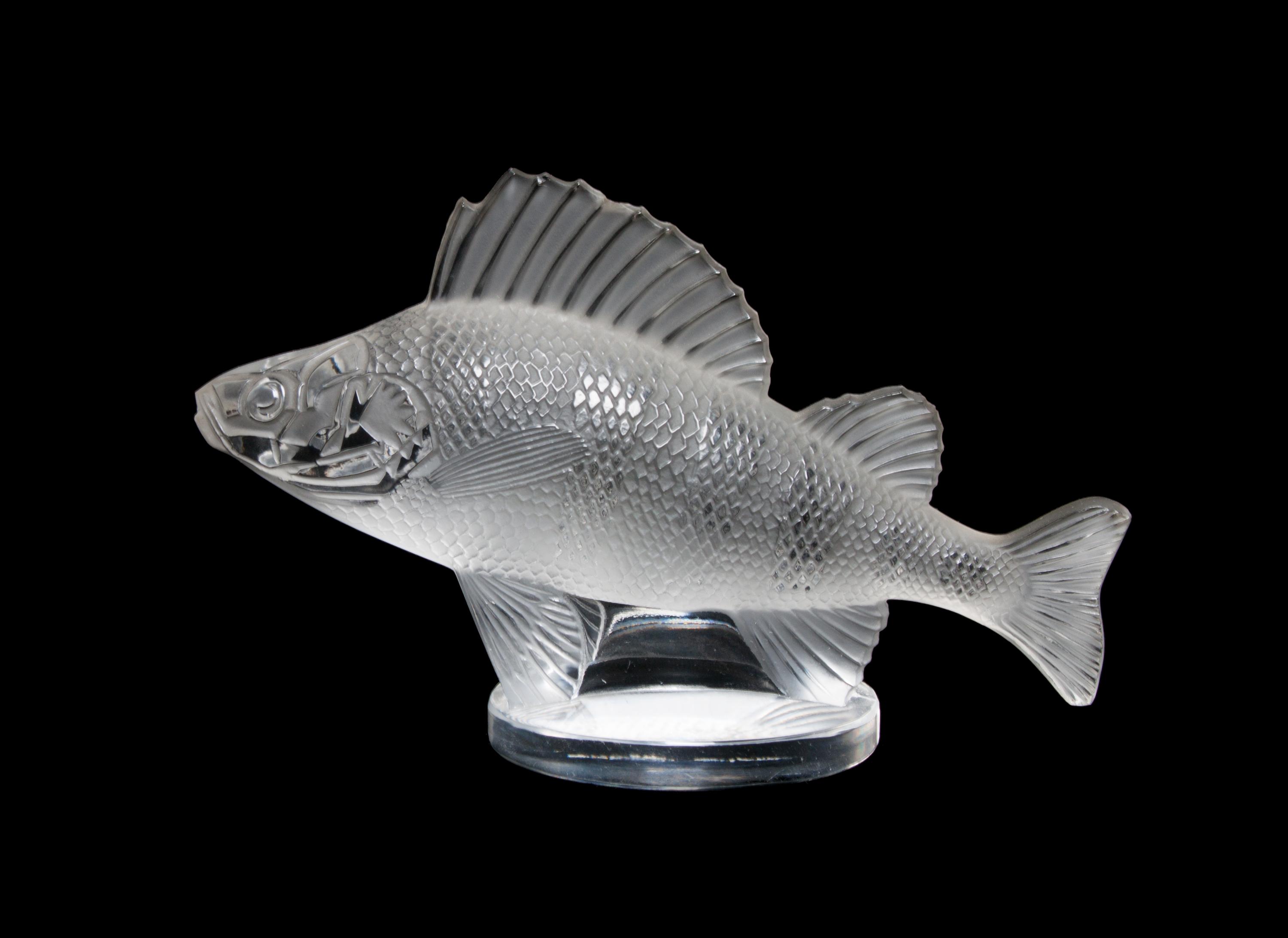 A Lalique Molded and Frosted Glass Paperweight Width 6 1/4 inches.