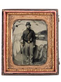 [CIVIL WAR]. Tintype of a Union cavalryman with saber and pistol, posed before painted camp scene.