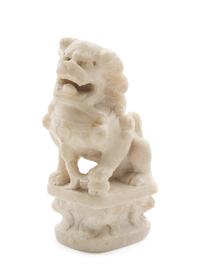 A Carved Marble Figure of a Fu Lion Height 5 1/4 x width 3 inches.