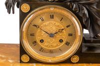 A Louis Philippe Bronze and Marble Figural Clock