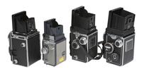 [CAMERAS]. 4 Twin Lens Reflex cameras with related material, incl. two Rolleiflex cameras.