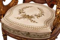 A Pair of Grotto Style Parcel Gilt Carved Walnut Armchairs