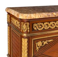 A Louis XVI Style Gilt Bronze Mounted Kingwood, Mahogany and Parquetry Brocatelle Violette d'Espagne Marble-Top Commode