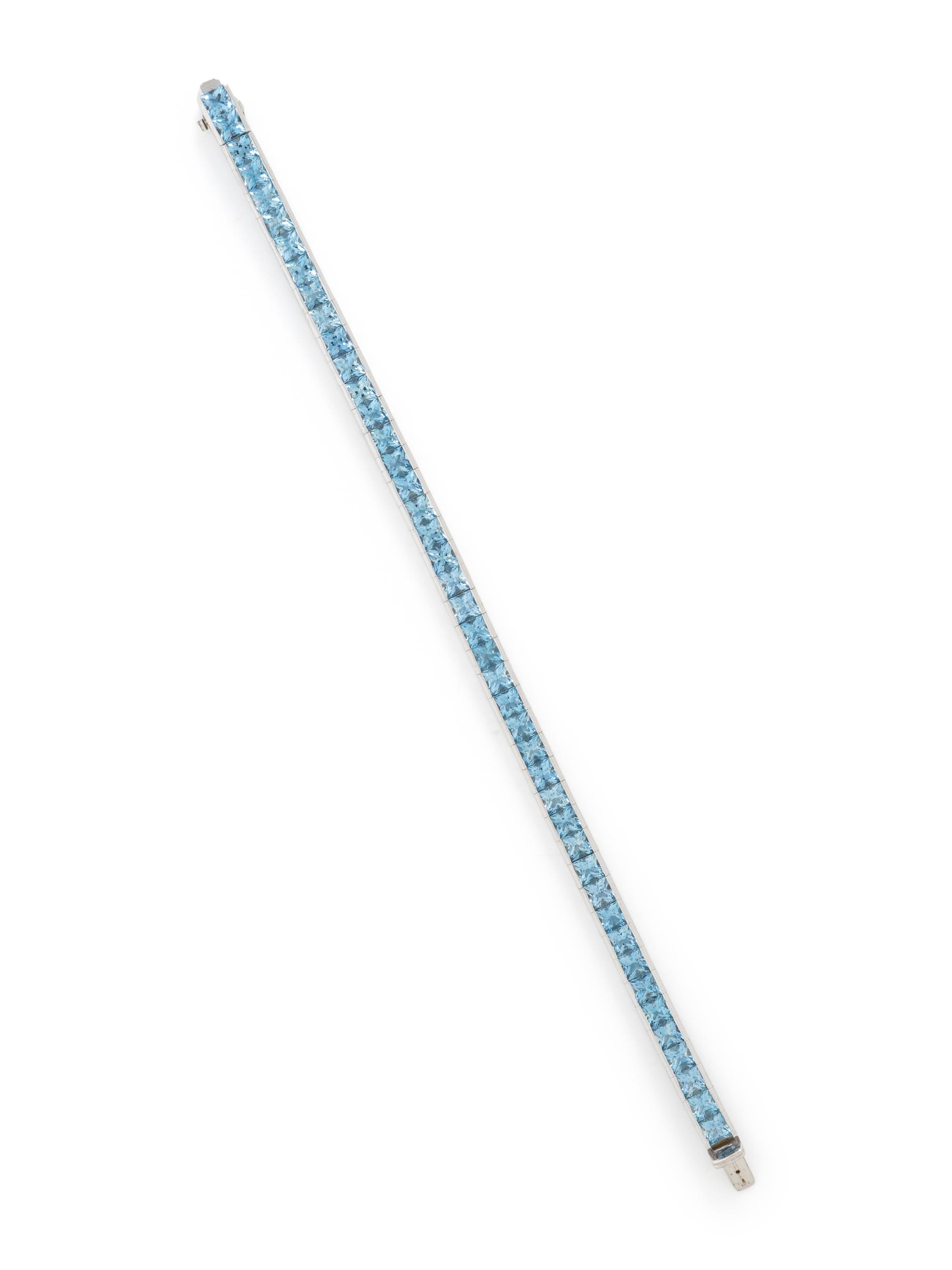 WHITE GOLD AND PRINCESS CUT AQUAMARINE LINE BRACELET