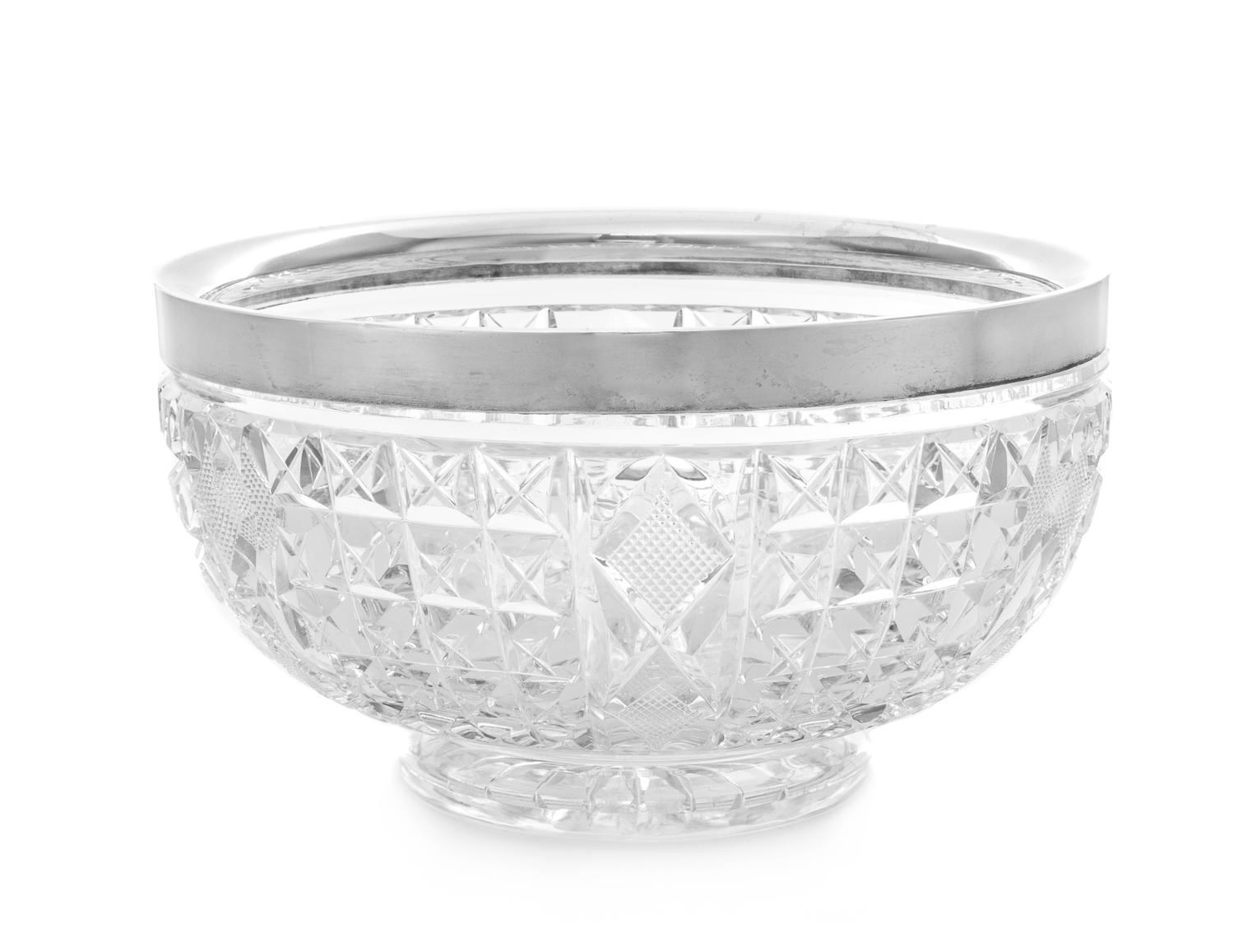 A George V Silver Mounted Cut Glass Bowl, Mappin & Webb, London, 1922, the silver rim above the bowl with geometric decoration.