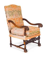 A Spanish Colonial Style Carved Walnut Open Armchair — 19TH/20TH CENTURY
