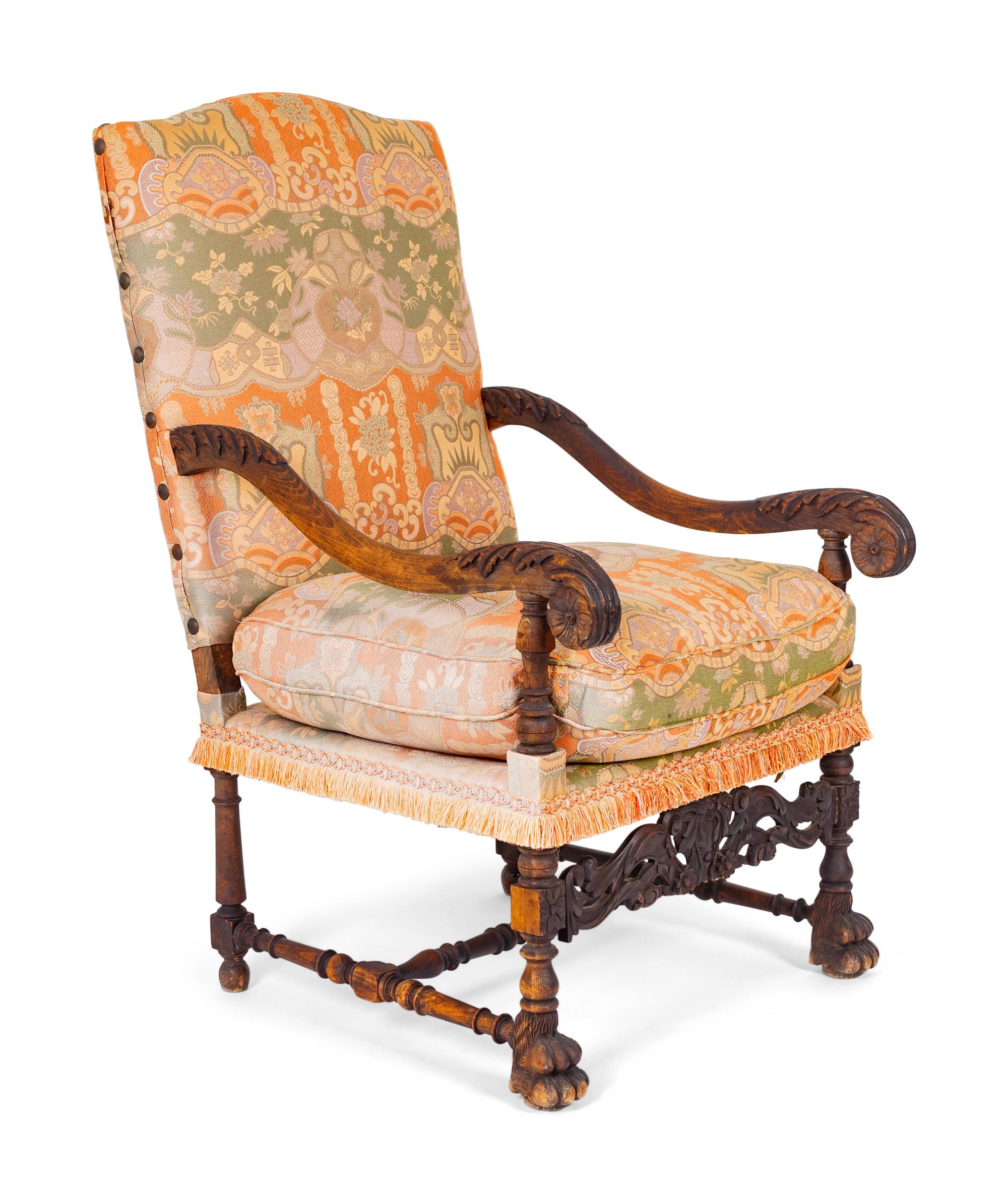 A Spanish Colonial Style Carved Walnut Open Armchair — 19TH/20TH CENTURY