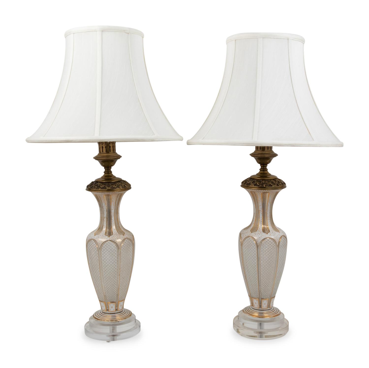 A Pair of Bohemian Parcel Gilt and Enamel Decorated Cut Glass Lamps