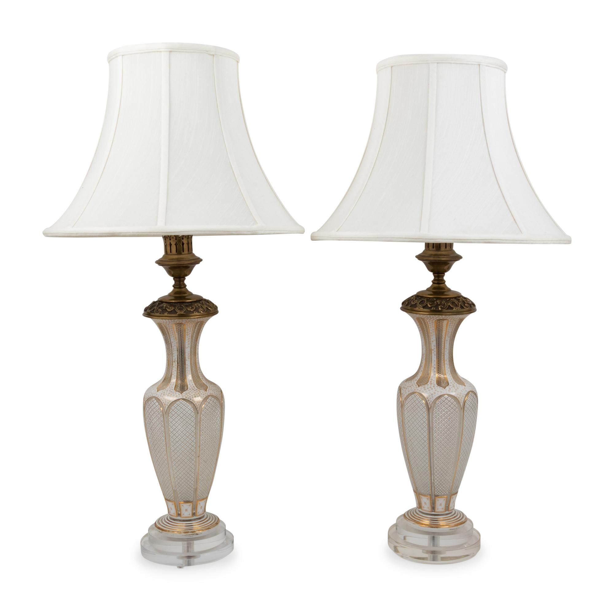 A Pair of Bohemian Parcel Gilt and Enamel Decorated Cut Glass Lamps