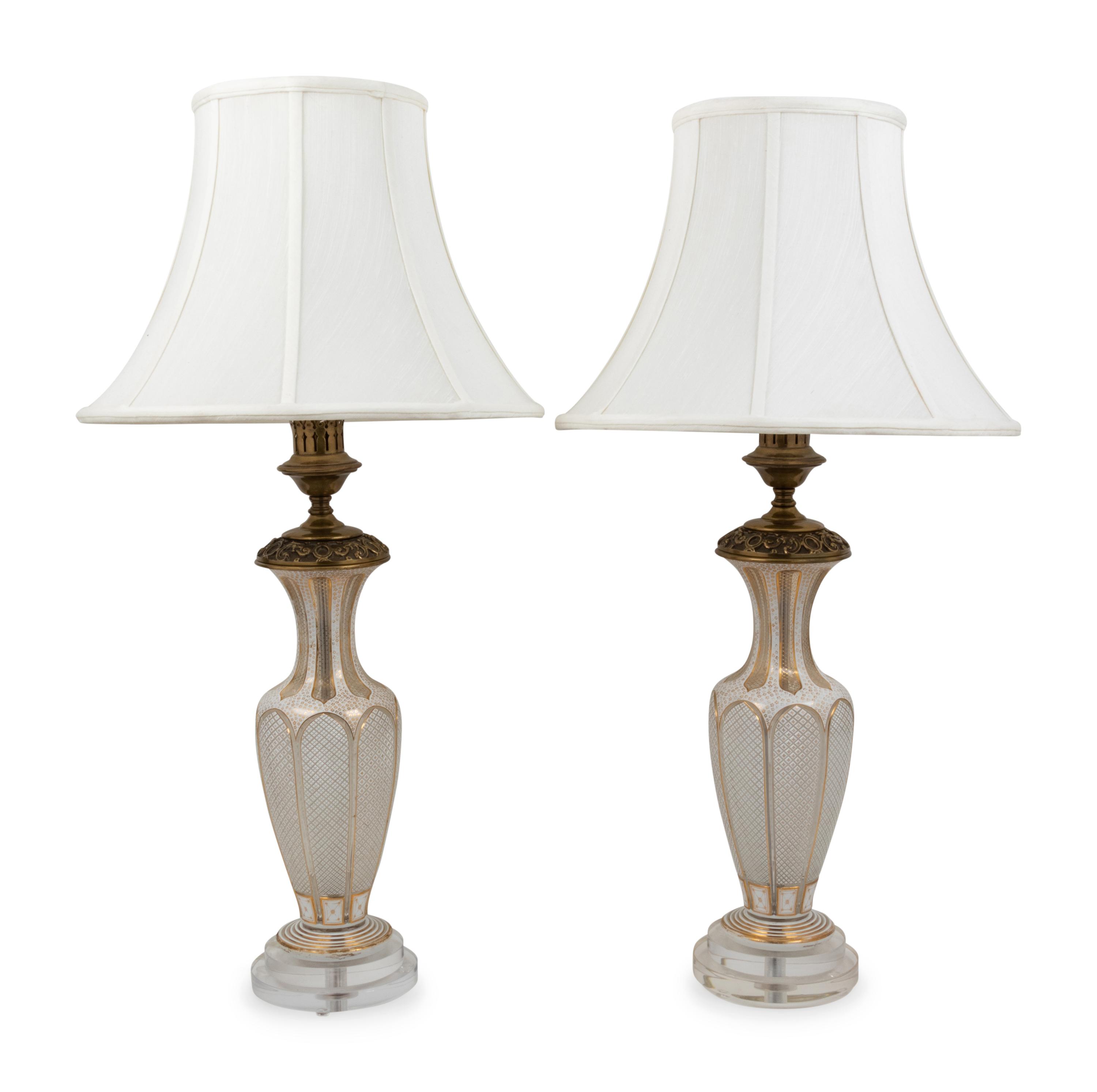 A Pair of Bohemian Parcel Gilt and Enamel Decorated Cut Glass Lamps