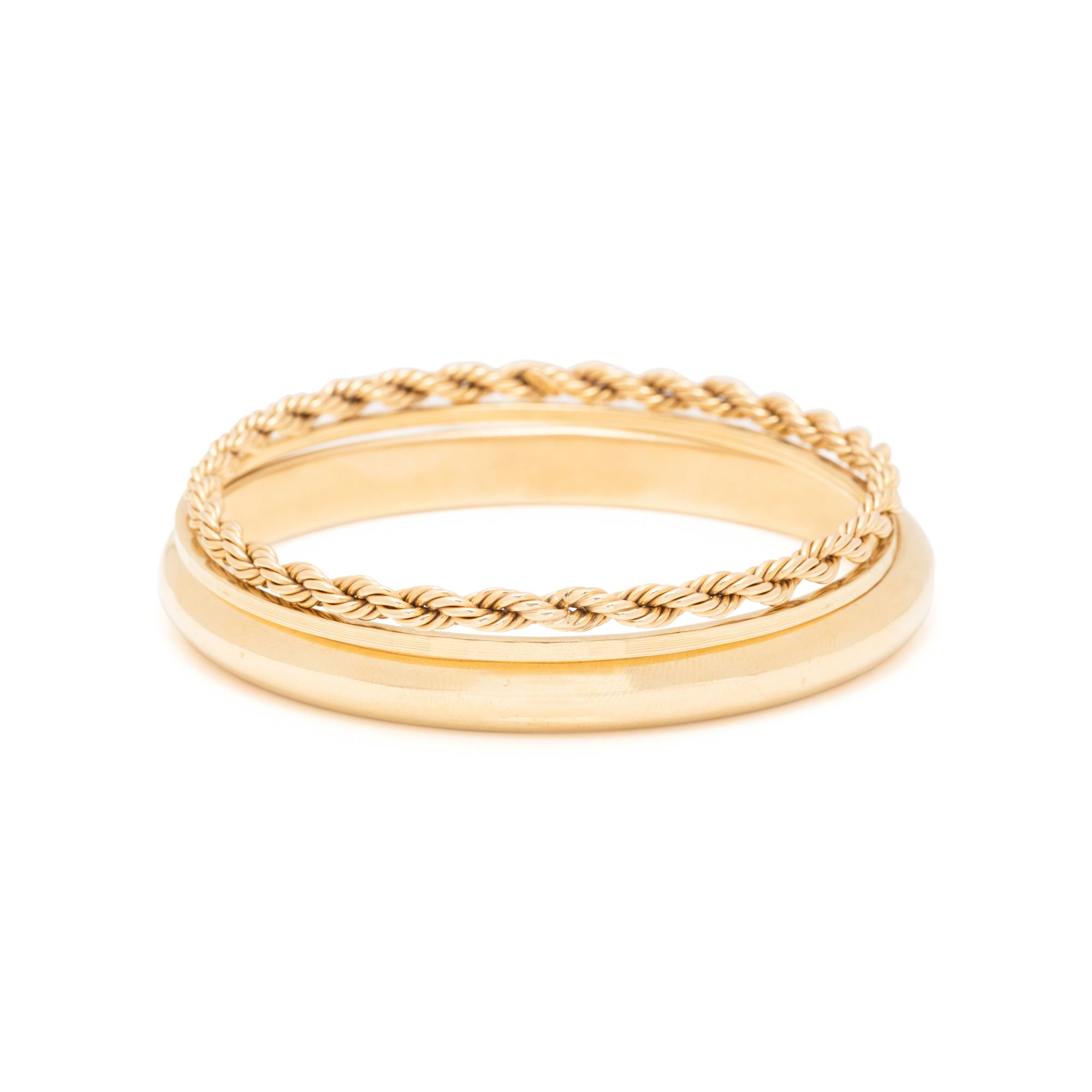 COLLECTION OF YELLOW GOLD BANGLE BRACELETS