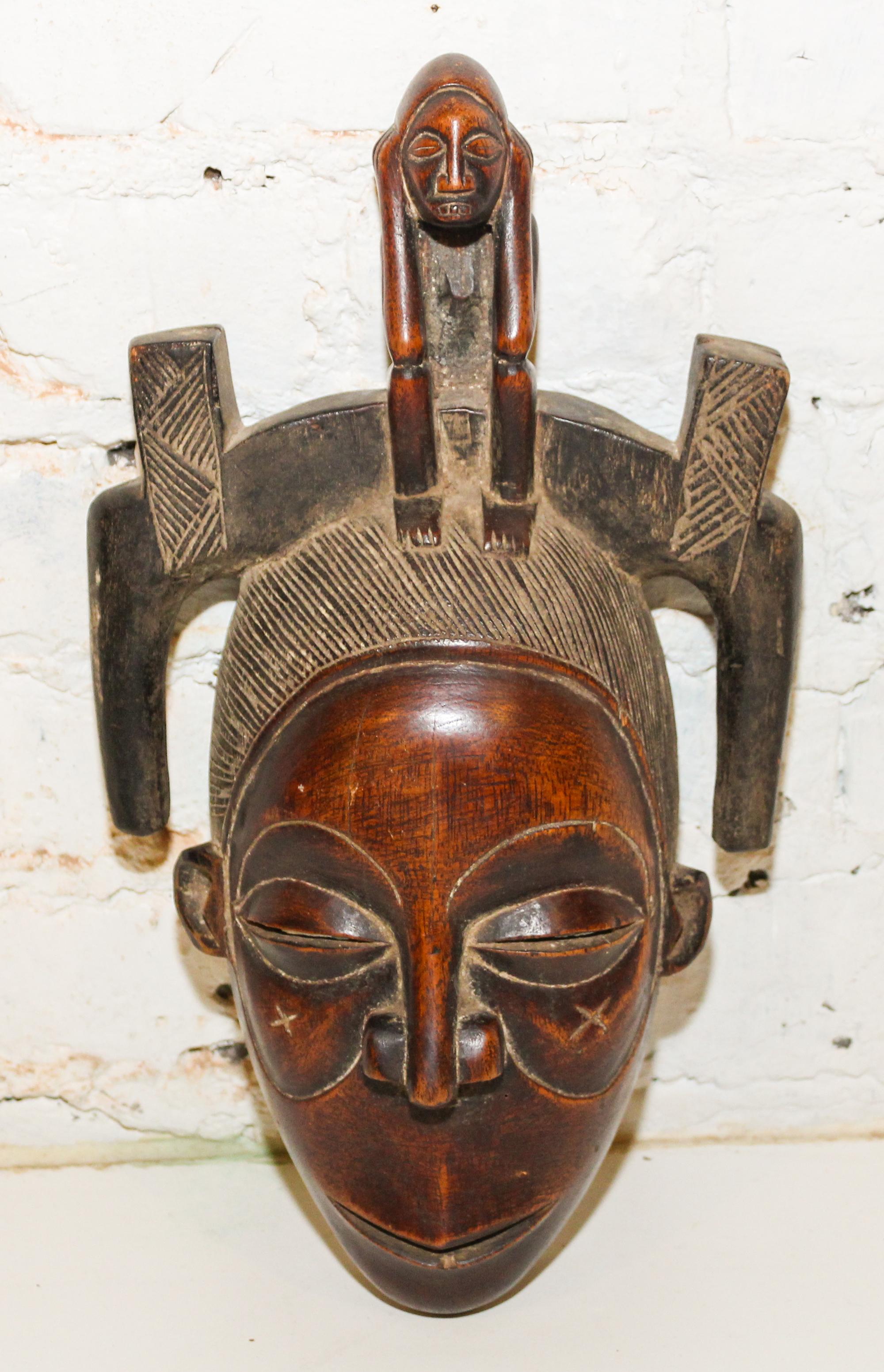 A Guro Wood Mask. Height 14 1/2 inches.