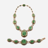A fourteen karat gold, jadeite jade, enamel, and seed pearl necklace with matching bracelet