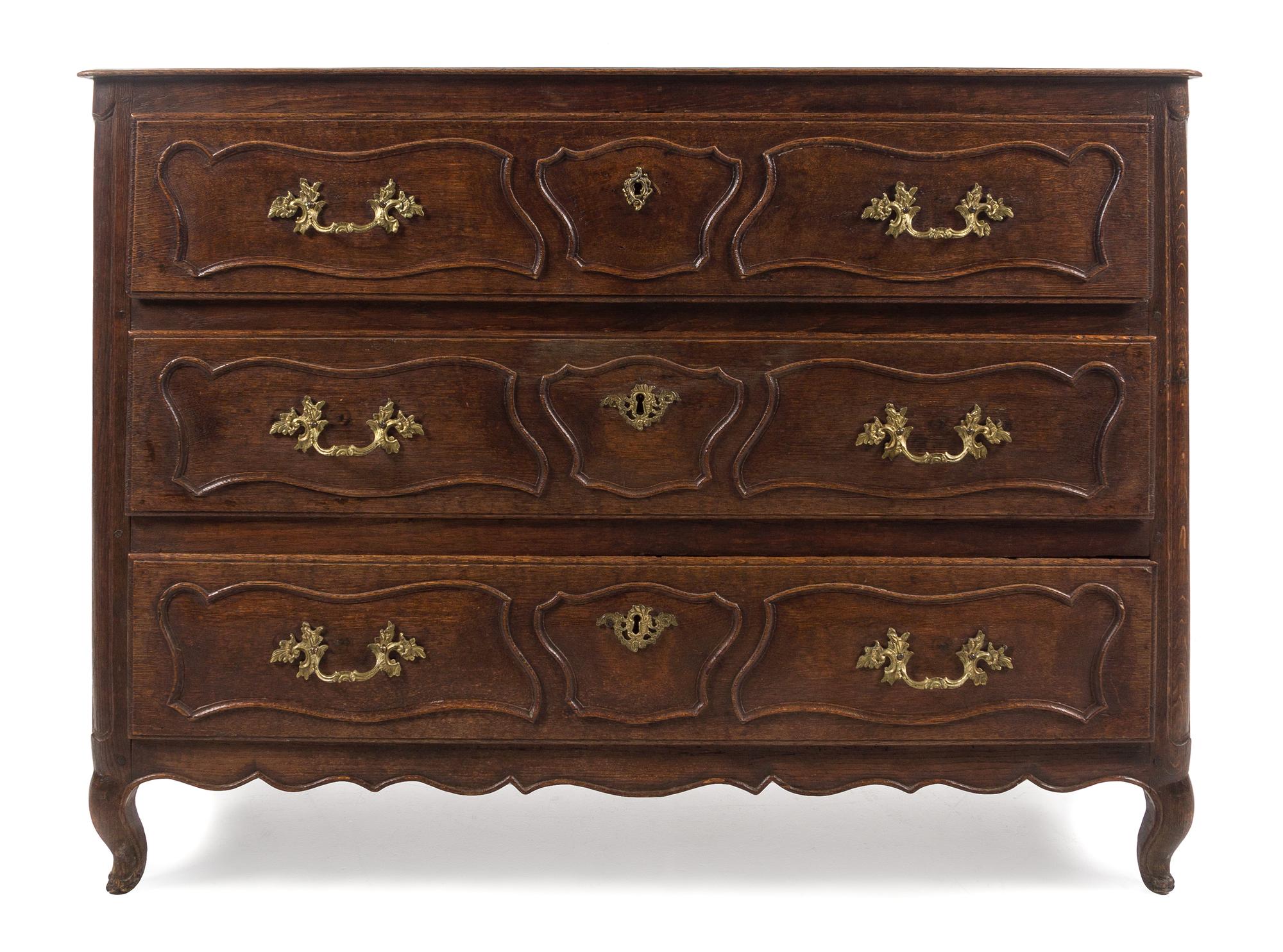 A French Provincial Oak Commode Height 38 x width 51 1/2 x depth 22 inches. — 19TH CENTURY