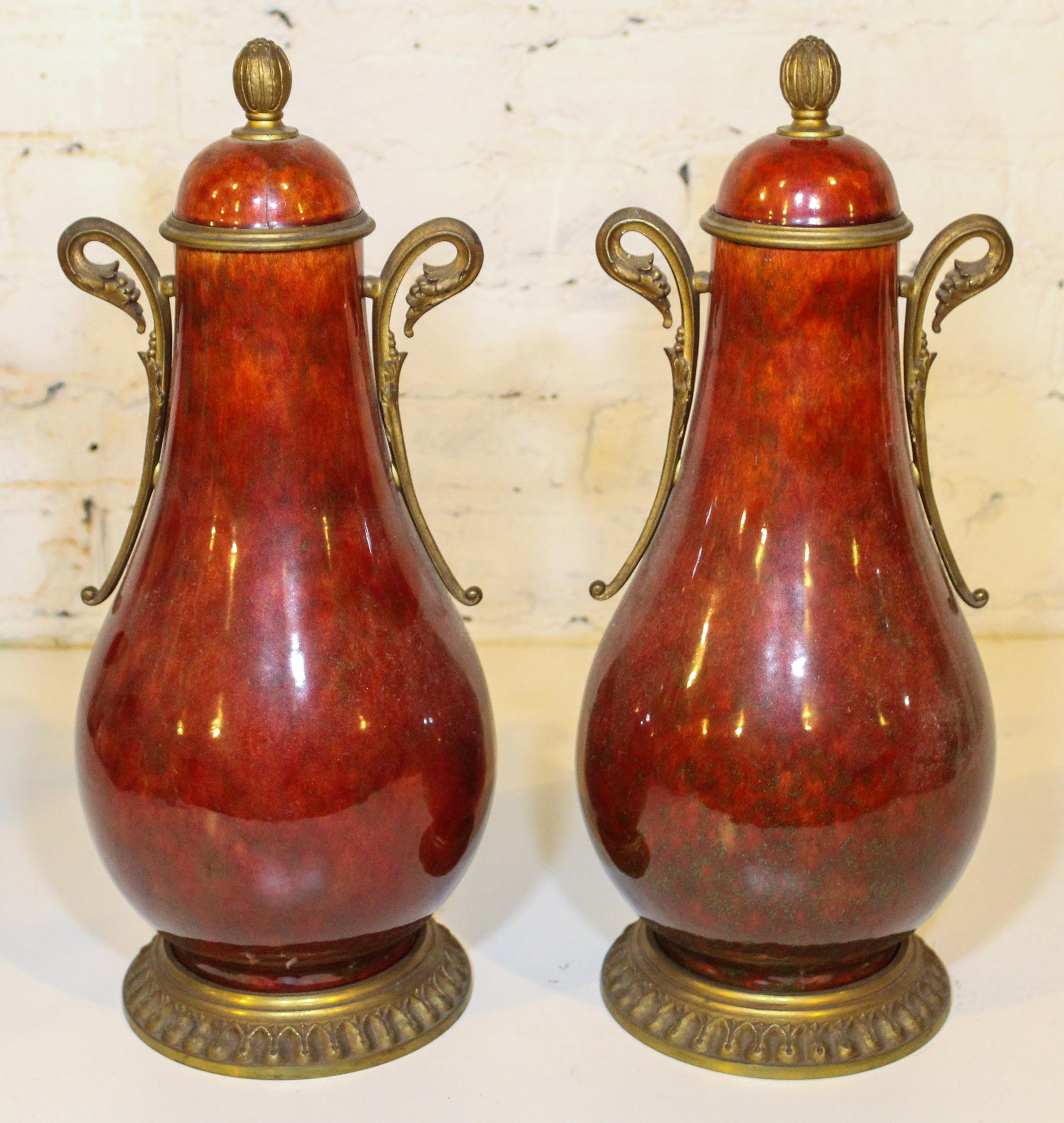 A Pair of Sevres Gilt Bronze Mounted Vases. Height 17 1/4 inches.