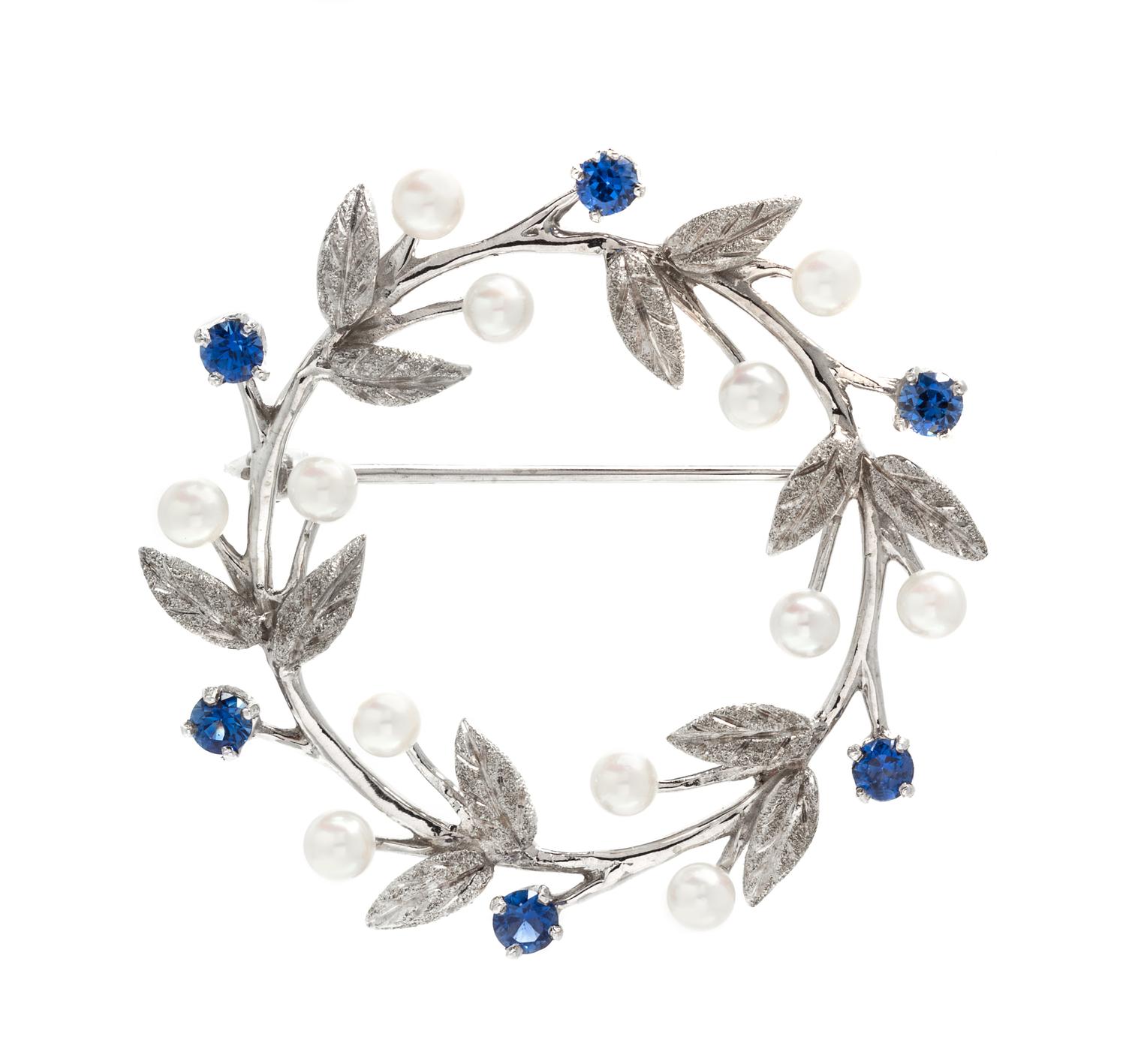 A 14 Karat White Gold, Sapphire and Cultured Pearl Wreath Brooch, 6.20 dwts.