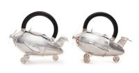 American, 20TH CENTURY, a pair of airplane form teapots