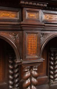 An Italian Baroque Style Carved Walnut and Marquetry Cabinet on Stand