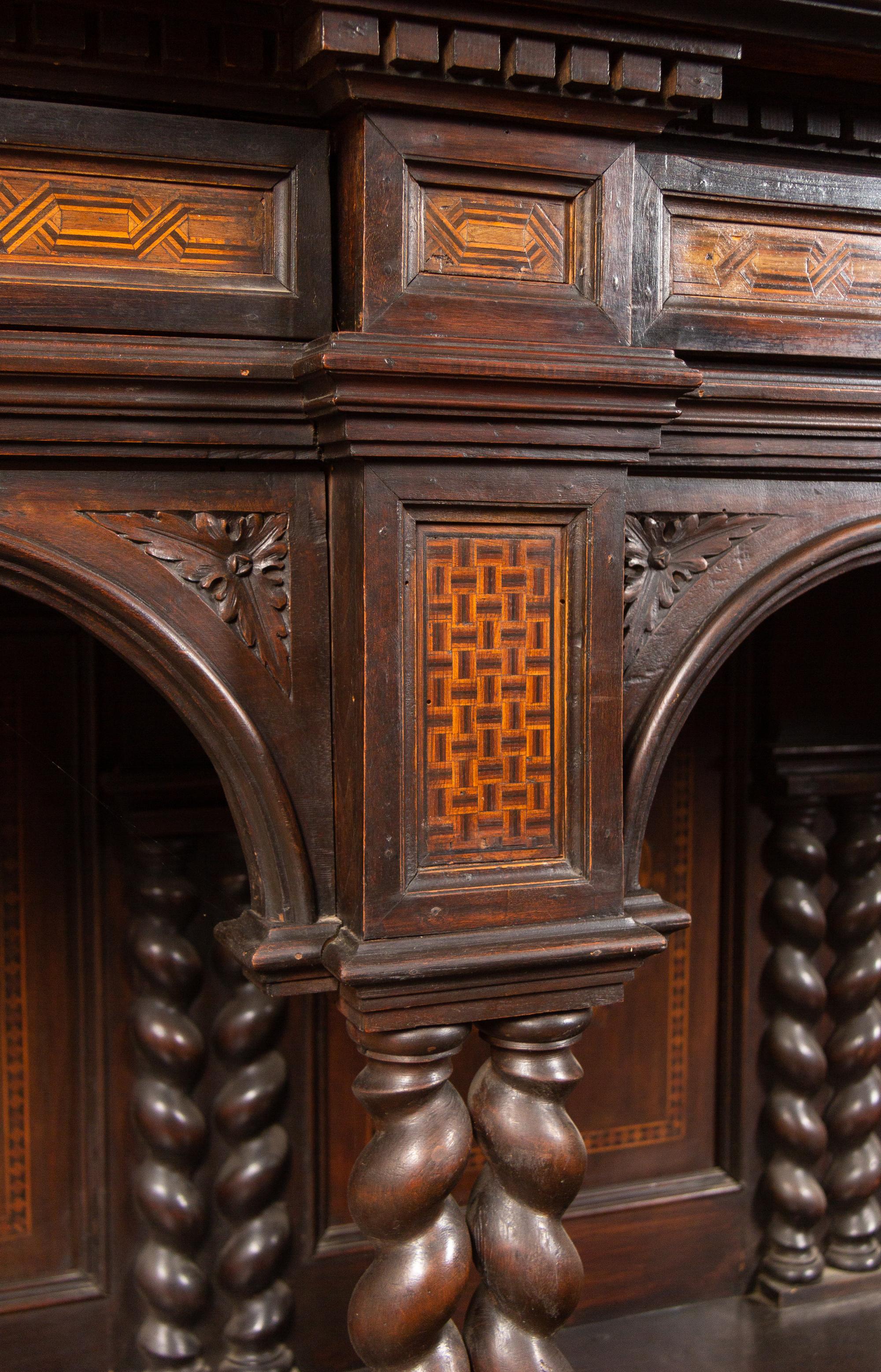 An Italian Baroque Style Carved Walnut and Marquetry Cabinet on Stand