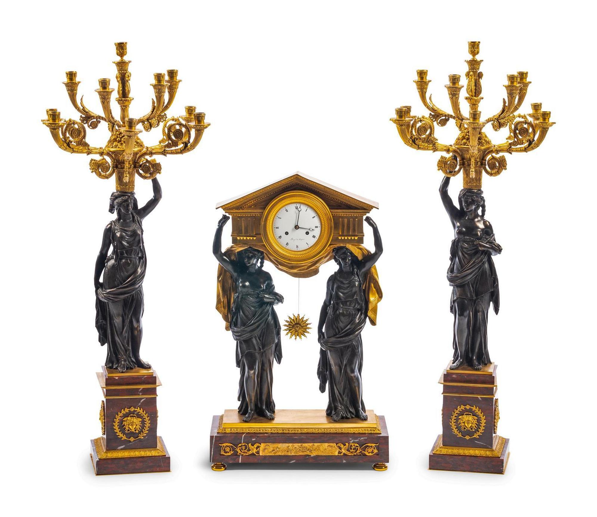 A Large French Gilt and Patinated Bronze and Rouge Marble Three-Piece Clock Garniture