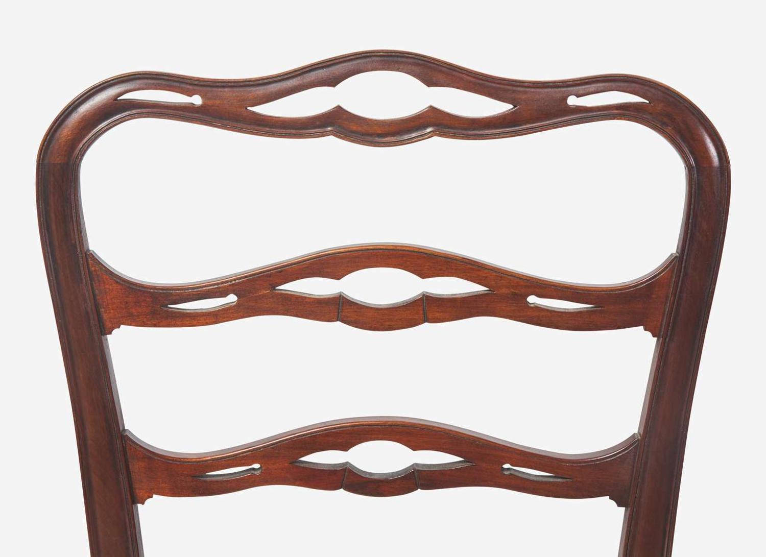 A set of eight Chippendale style mahogany ribbon-back dining chairs, 20th century