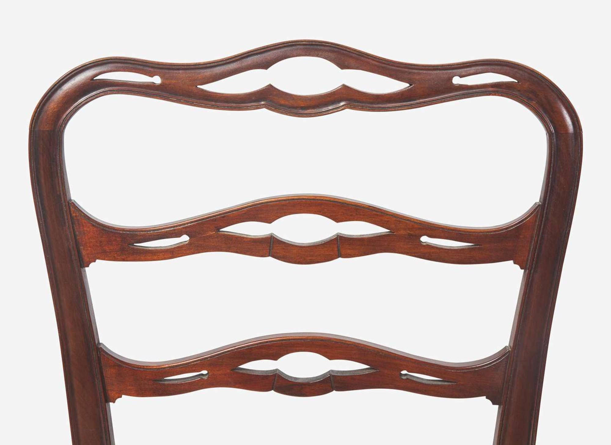 A set of eight Chippendale style mahogany ribbon-back dining chairs, 20th century