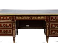 A Louis XVI Style Gilt Bronze Mounted Mahogany Desk — EARLY 20TH CENTURY