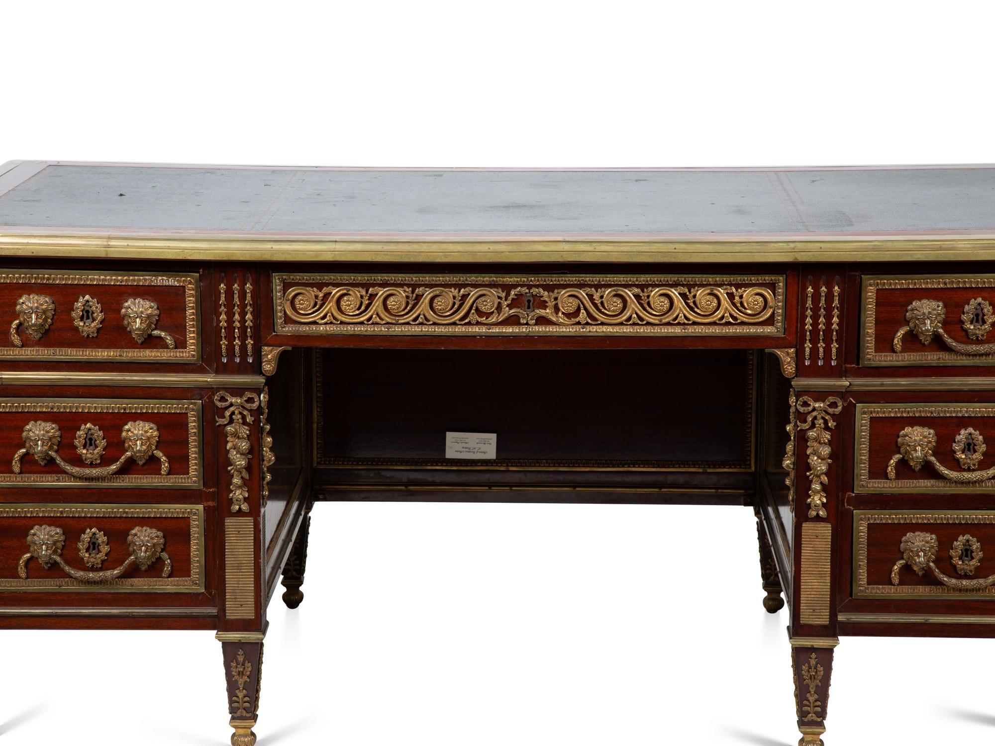 A Louis XVI Style Gilt Bronze Mounted Mahogany Desk — EARLY 20TH CENTURY