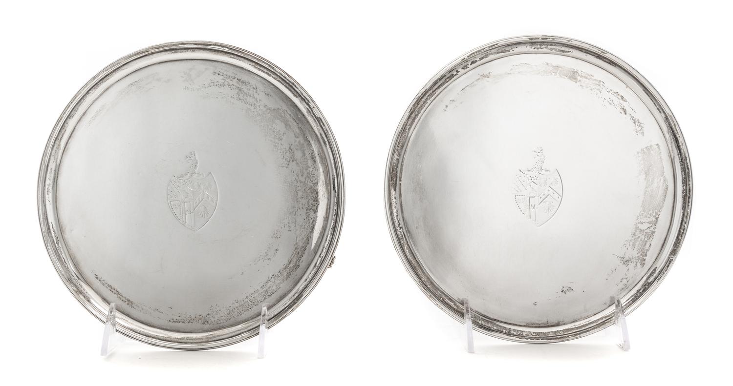 A Pair of George III Silver Salvers, John Edwards III, London, 1790, each centered by an engraved armorial shield surmounted by dragon