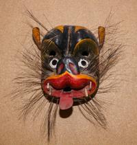 A Mexican Polychromed Wood Mask of a Beast Height 11 inches.