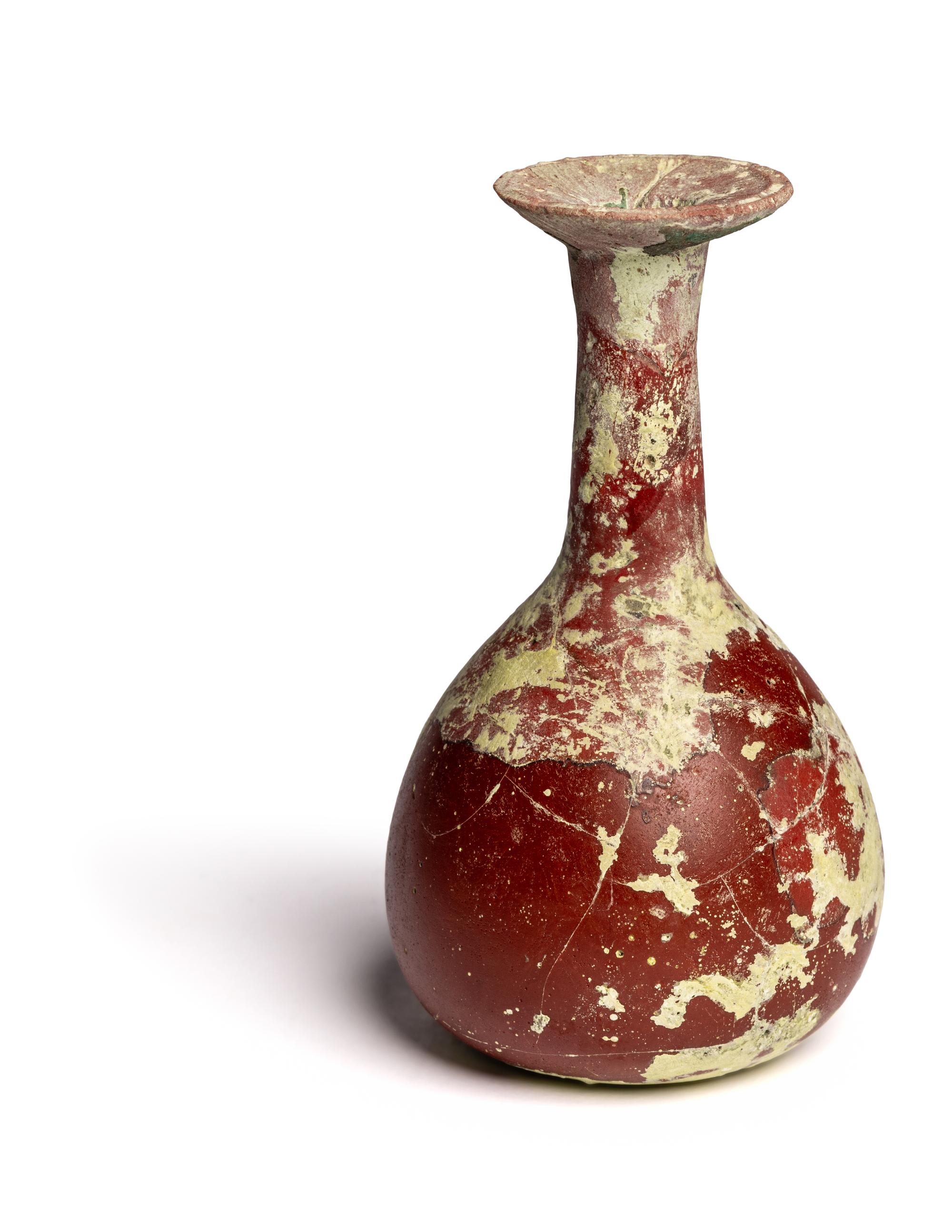 A Hellenistic or Roman Opaque Dark Red Glass Bottle