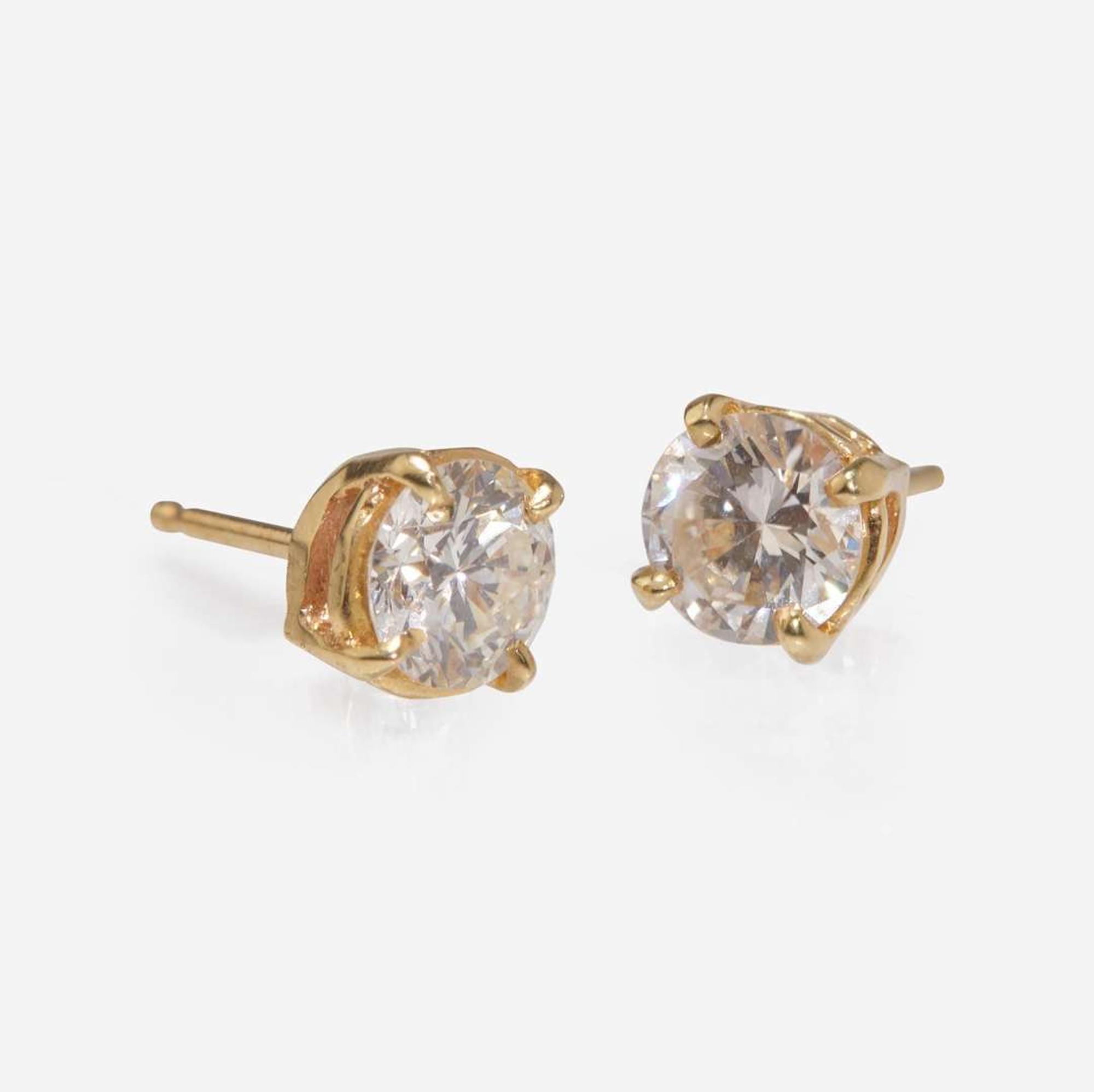 A Pair of 14K Yellow Gold Diamond Studs