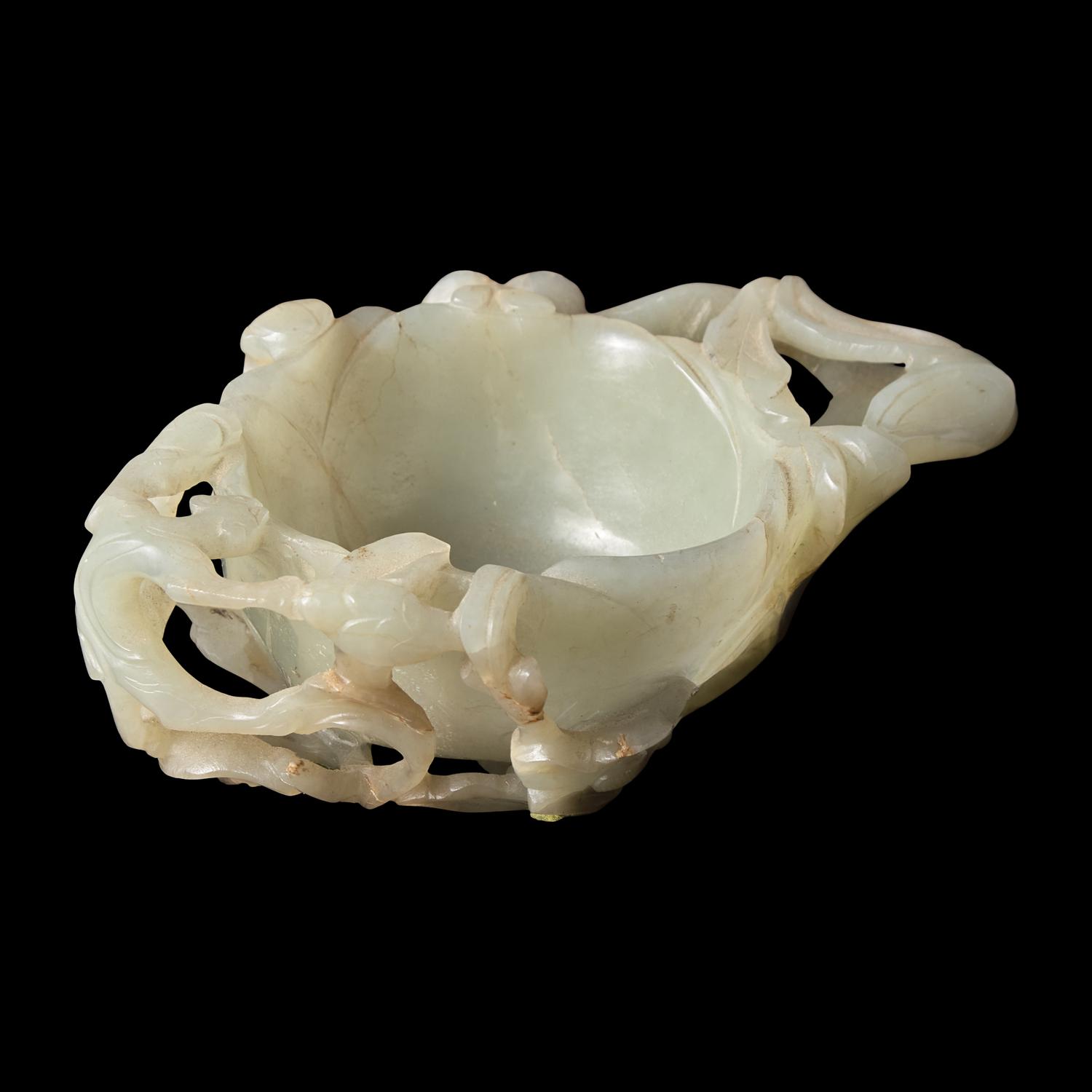 A Chinese Carved Pale Celadon Jade Floriform Coupe, Qing Dynasty or Earlier 清或更早 青白玉鏤雕梅花洗