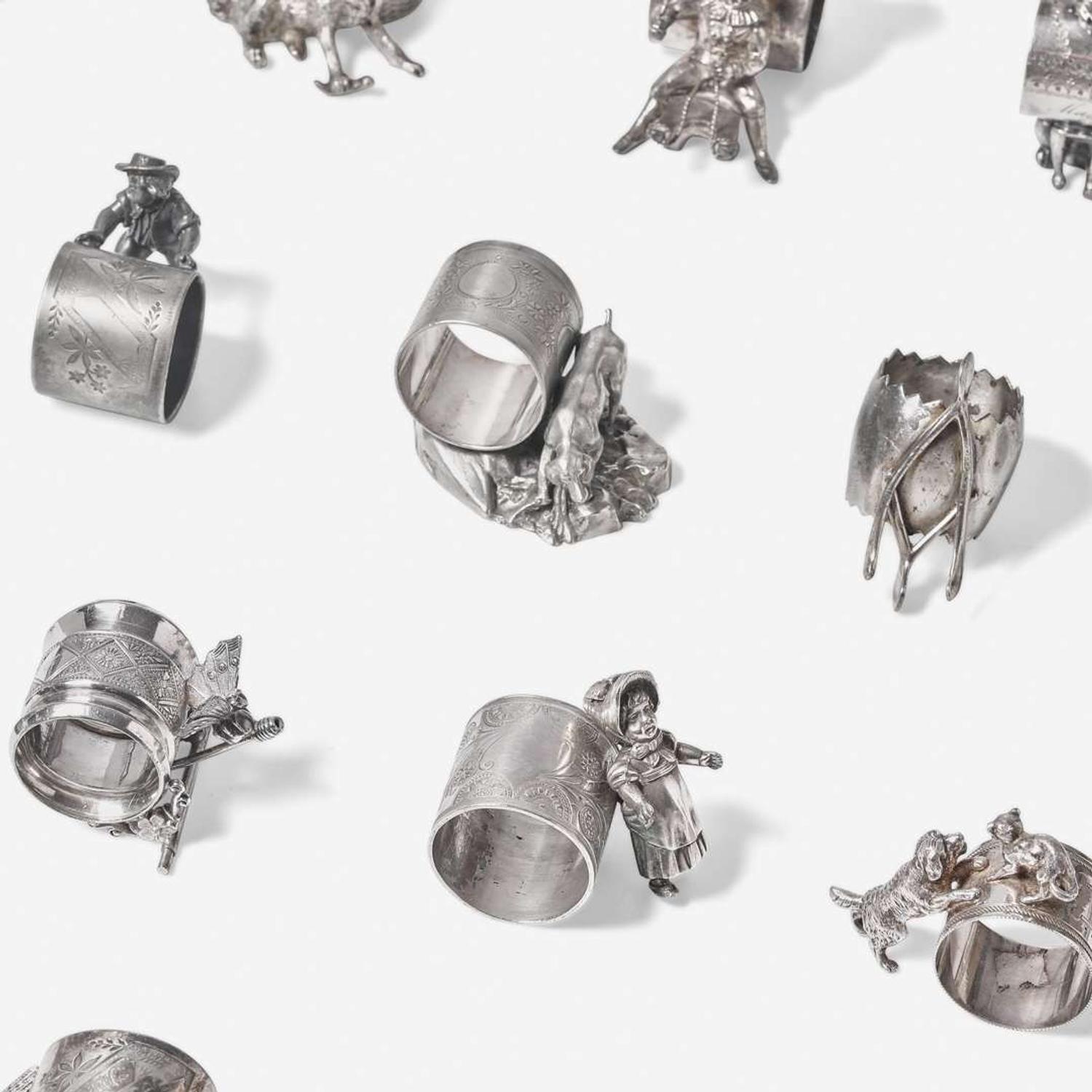 A collection of thirty-four Victorian silverplated and pewter napkin holders Various American and Canadian makers, Connecticut, Massachusetts, and Ontario, late 19th century