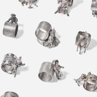 A collection of thirty-four Victorian silverplated and pewter napkin holders Various American and Canadian makers, Connecticut, Massachusetts, and Ontario, late 19th century