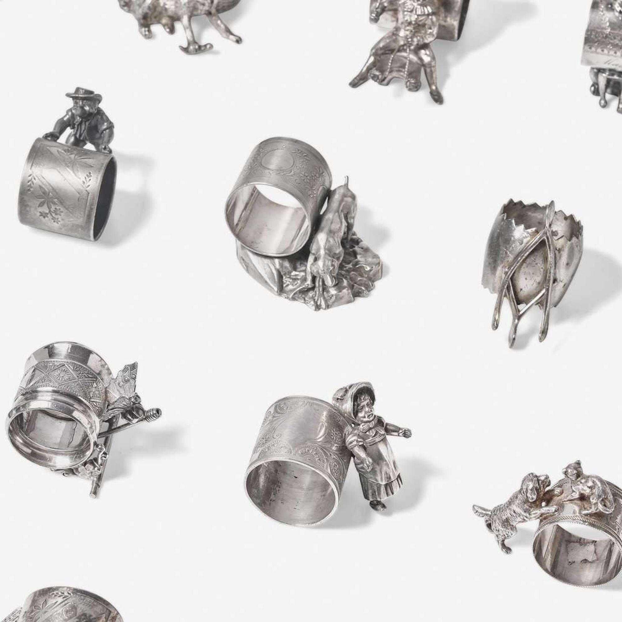 A collection of thirty-four Victorian silverplated and pewter napkin holders Various American and Canadian makers, Connecticut, Massachusetts, and Ontario, late 19th century