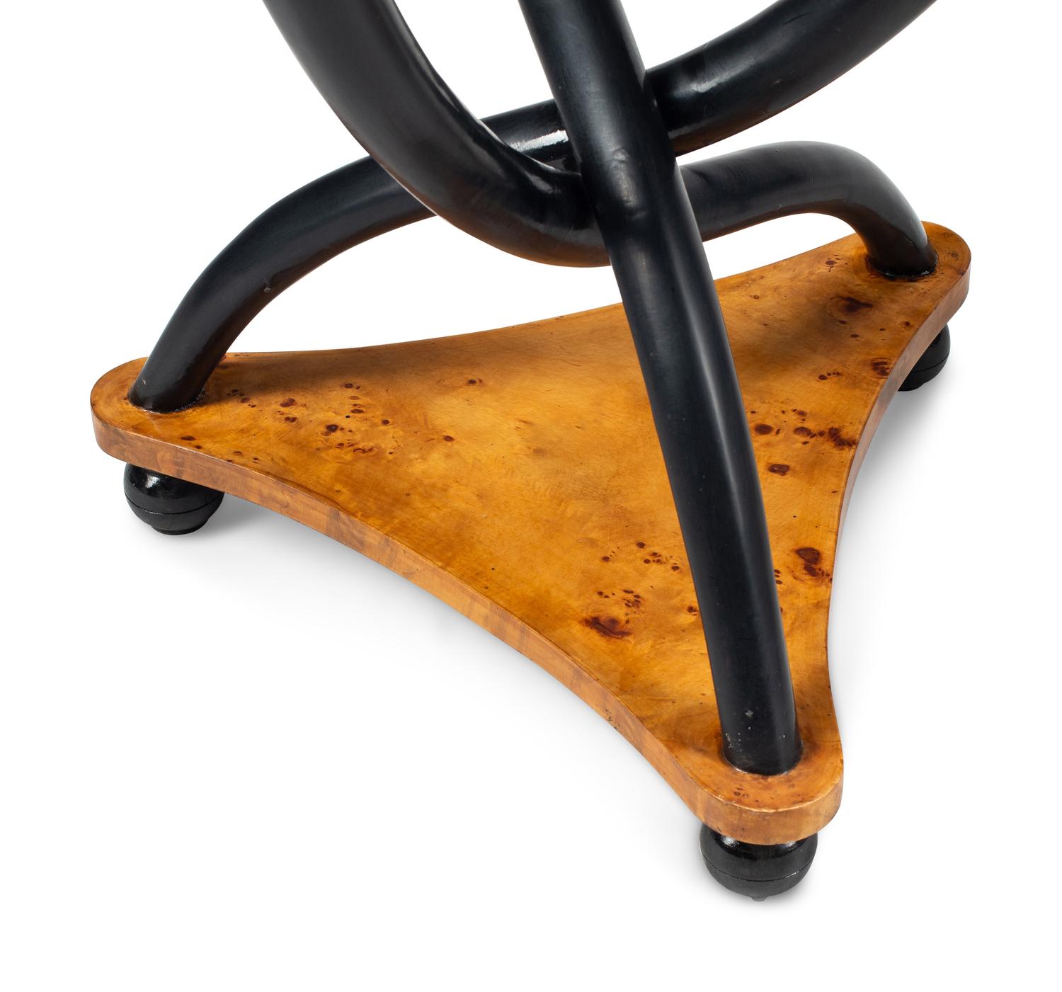 A Pair of Biedermeier Style Parcel Ebonized Triangular Side Tables