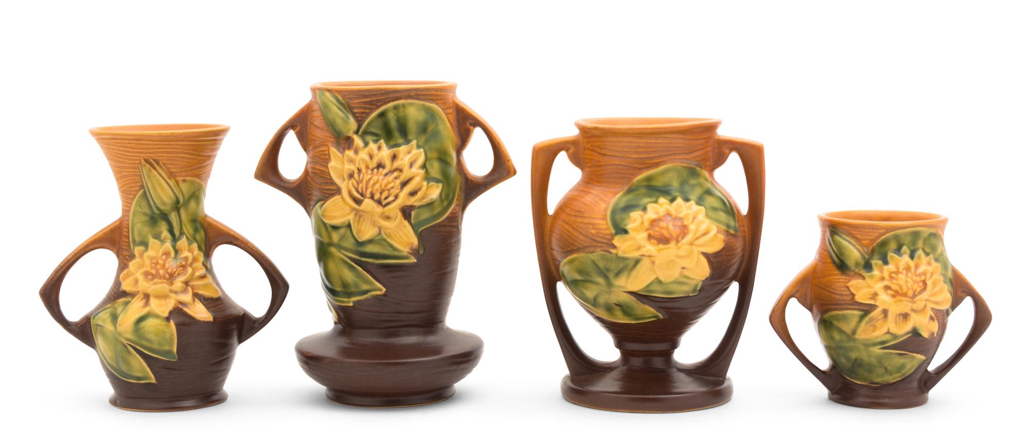 Four Roseville Waterlilly Pottery Vases Height of tallest 7 1/4 inches.