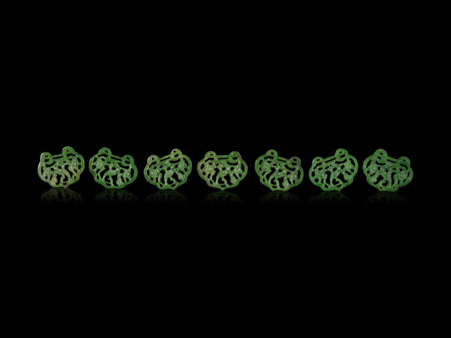 Twenty-One Chinese Spinach Jade Pendants