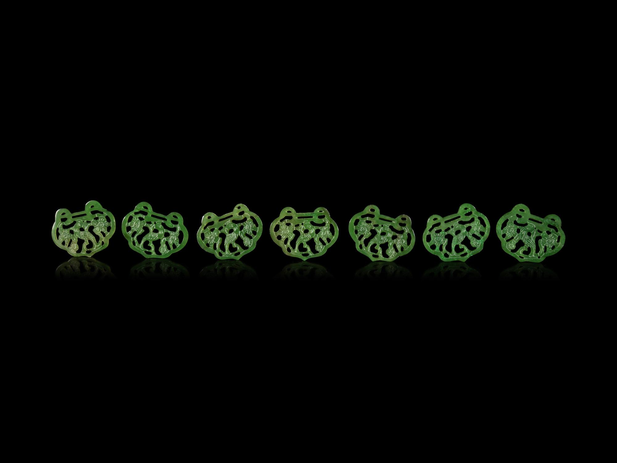 Twenty-One Chinese Spinach Jade Pendants