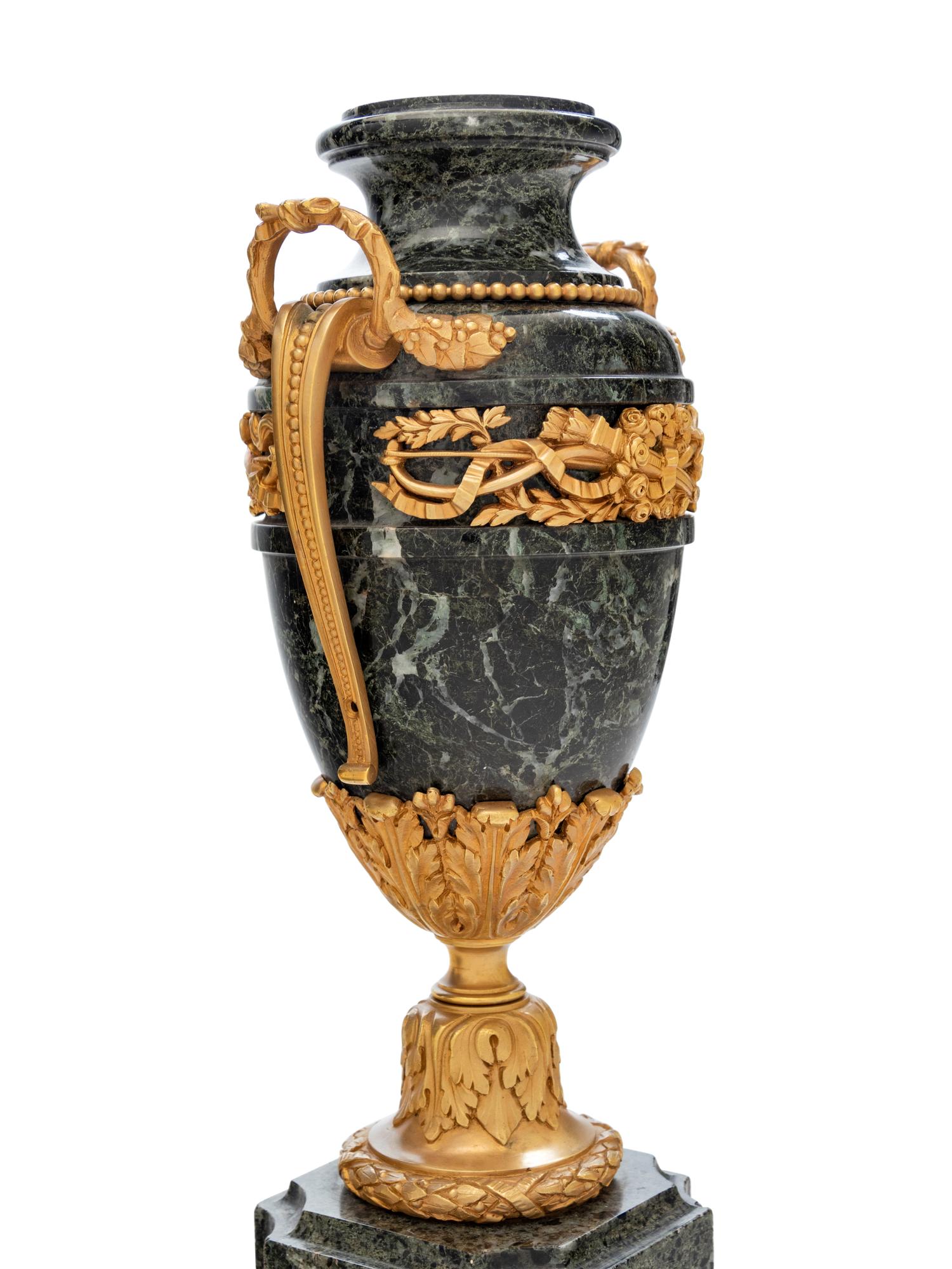 A Pair of Neoclassical Gilt Bronze Mounted Marble Urns