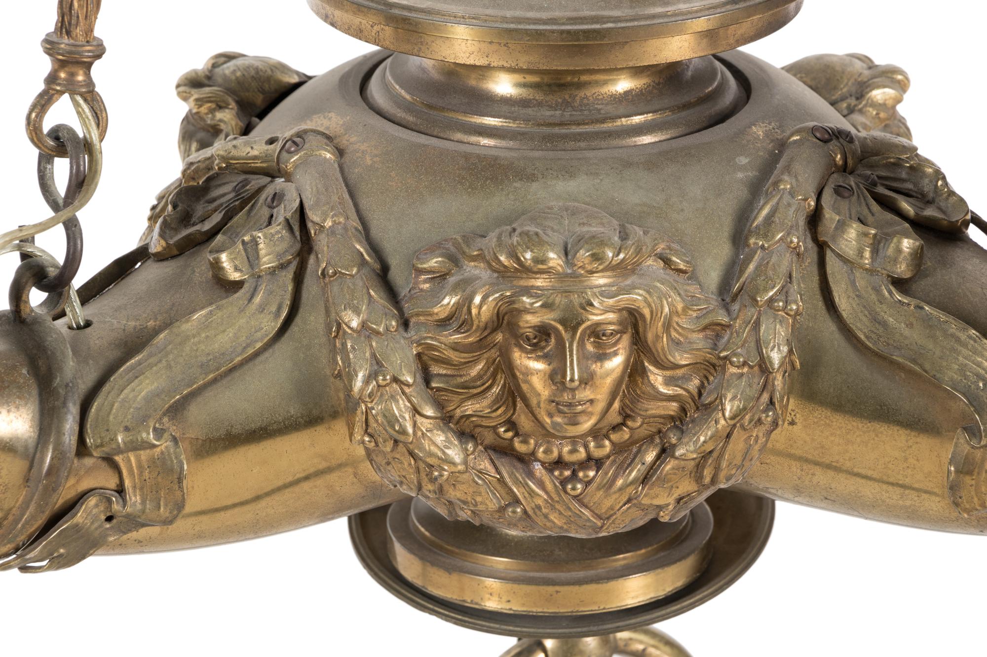 A Neoclassical Gilt Bronze Four-Light Chandelier with Frosted Glass Shades