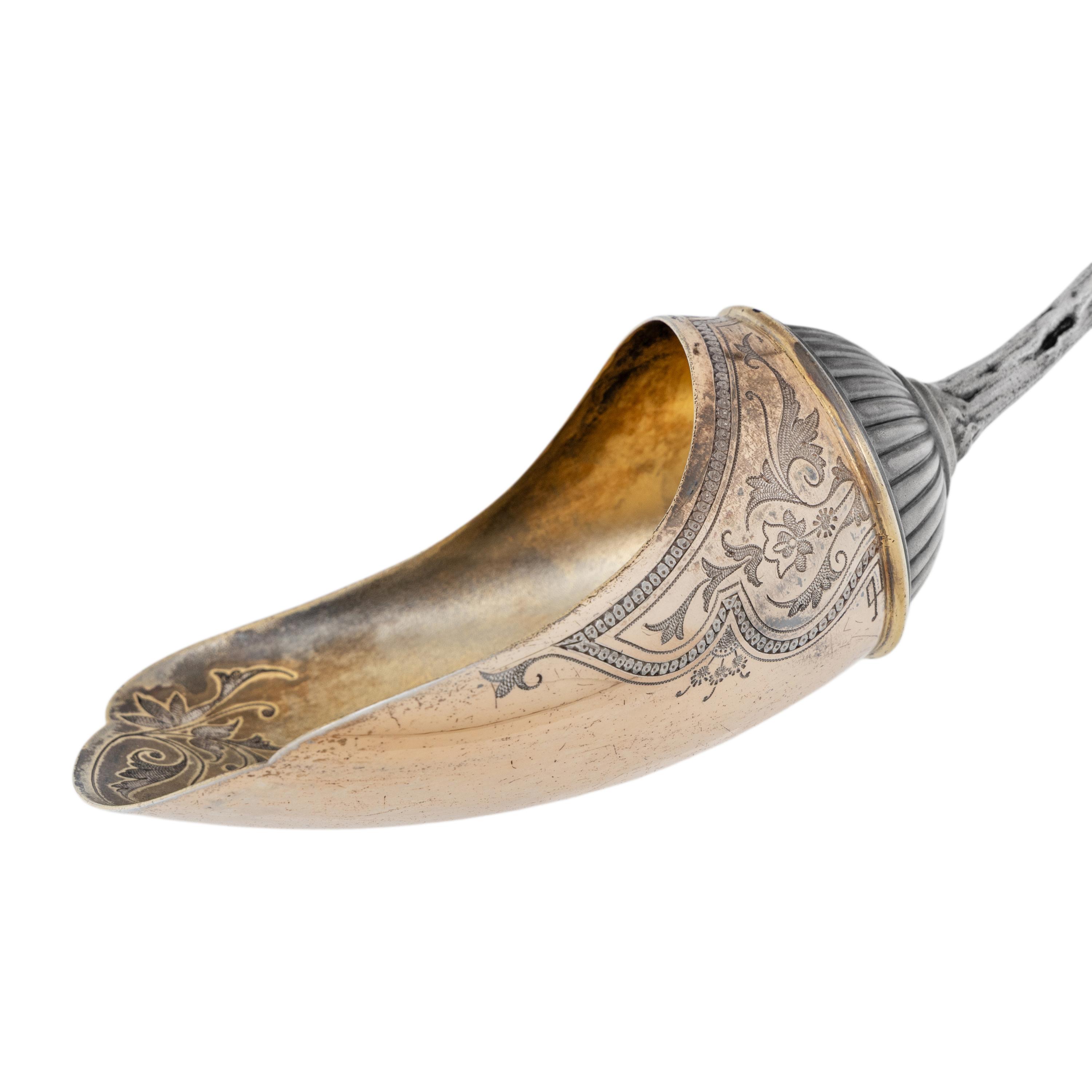 A Tiffany and Co. Silver Nut Scoop and Set of Six Nut Picks
